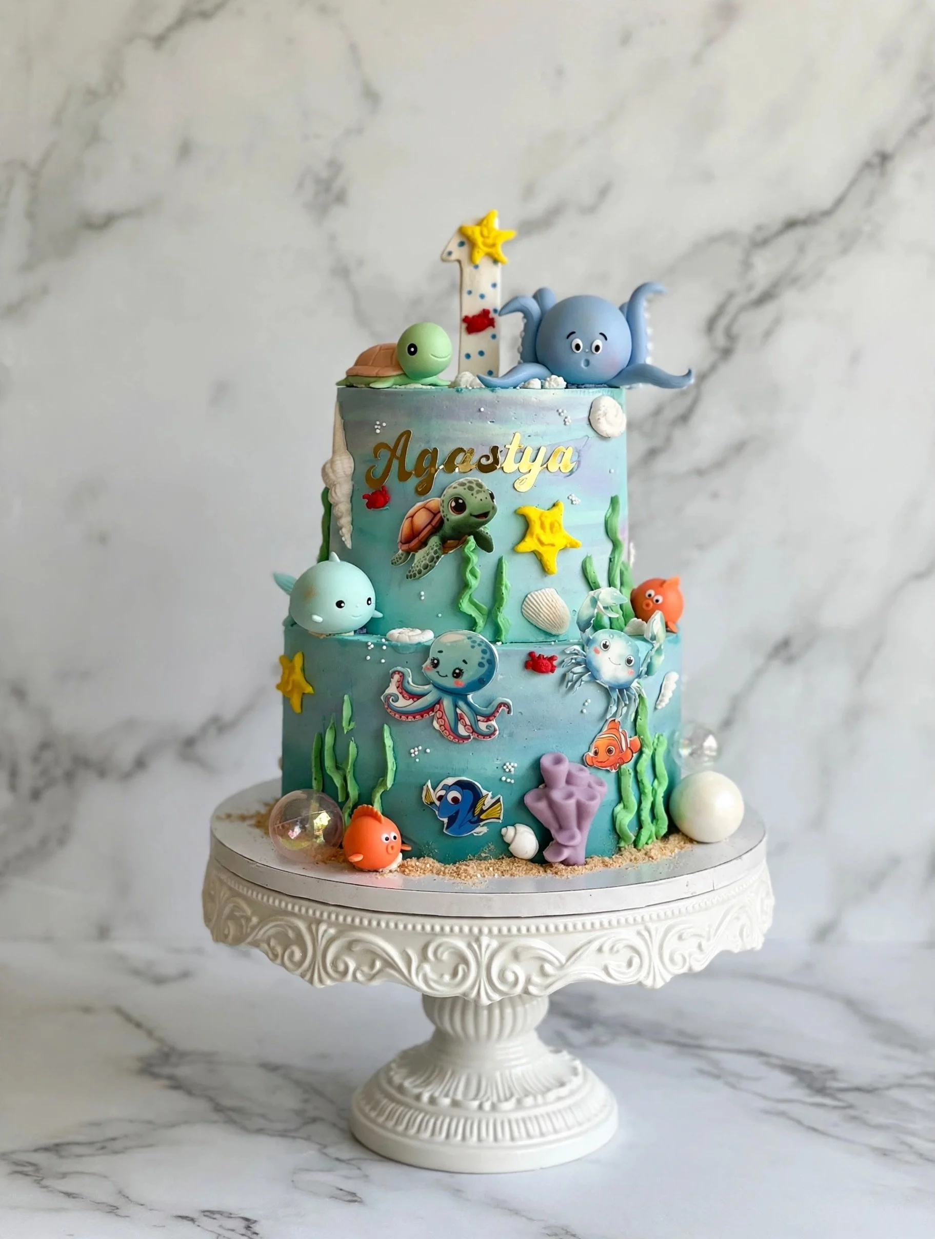 First Birthday cakes have to be extra special!
Agastya is ONE-der the sea! 🐙🌊 Celebrating one trip around the sun with turtles, starfish &amp; all his fishy friends. Happy 1st birthday, little explorer!

#OneDerTheSea #UnderTheSeaCake #FirstBirthda