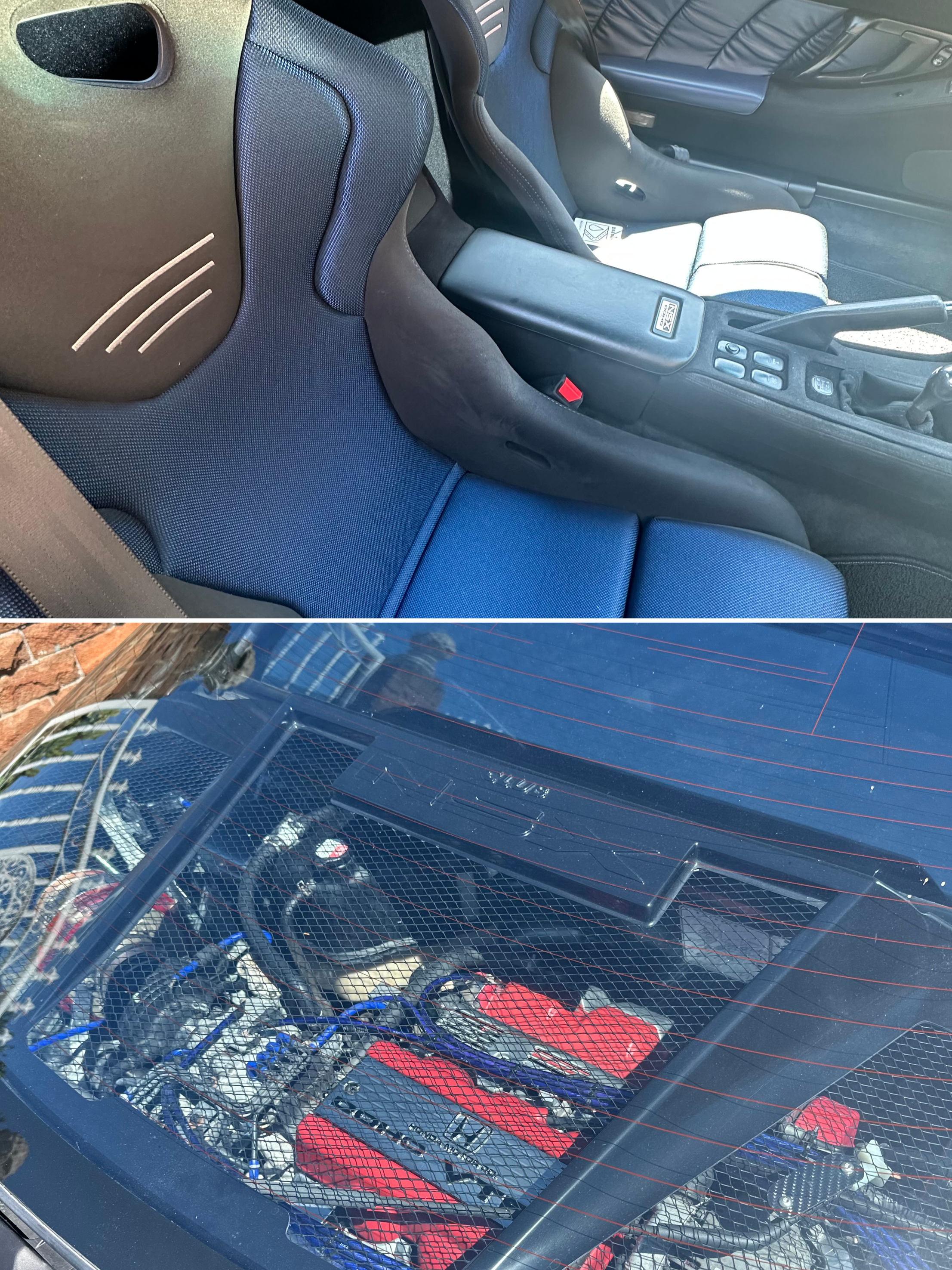 View through the rear windshield of a vehicle showing a car's interior with seats, gear shift, and a storage cargo area filled with tools and equipment, with a brick wall and a patio chair visible outside.