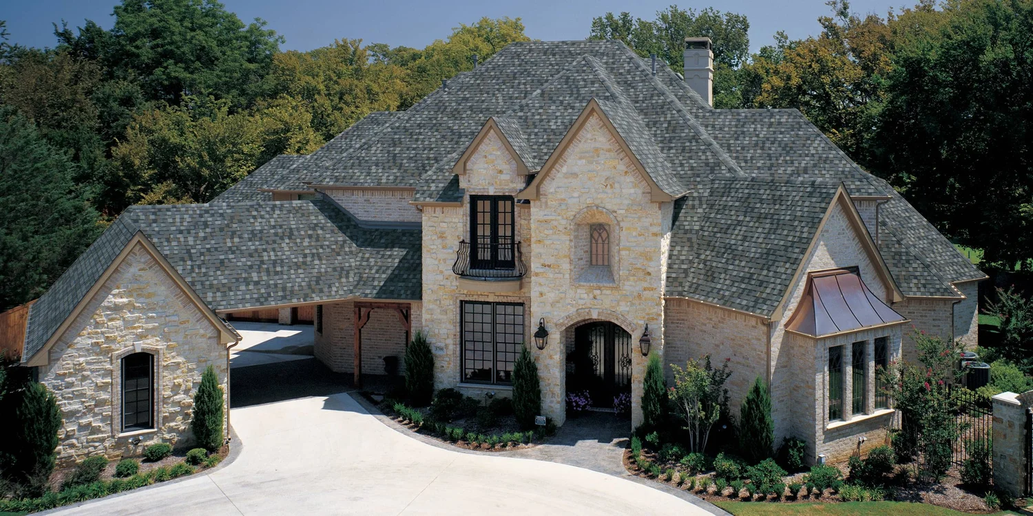 TAMKO StormFighter FLEX Thunderstorm Grey shingle roof installed on a home