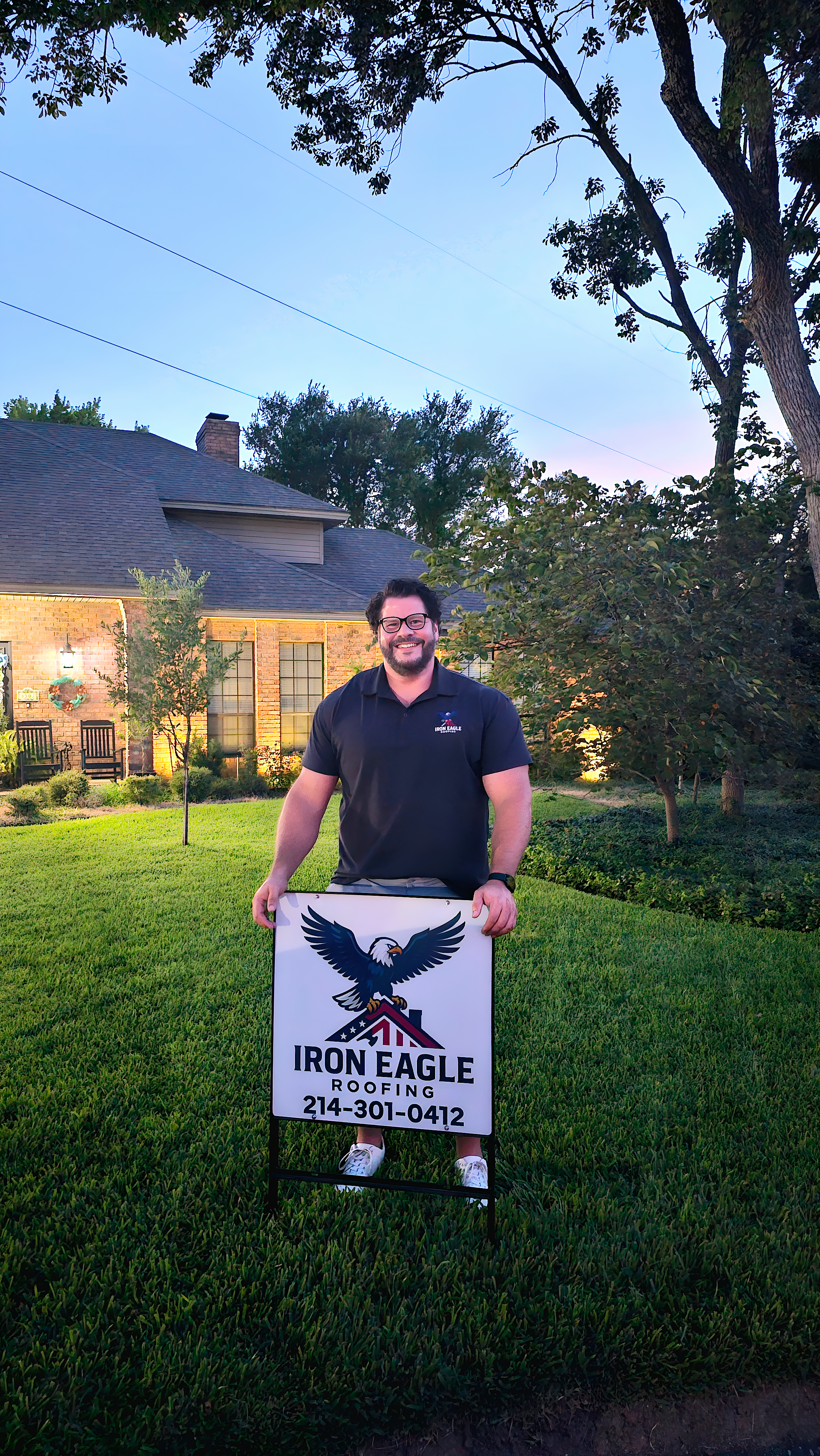 Kyle with Iron Eagle Roofing yard sign