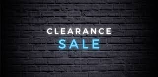 Text on a brick wall that reads 'Clearance Sale' with 'Clearance' in white and 'Sale' in blue.