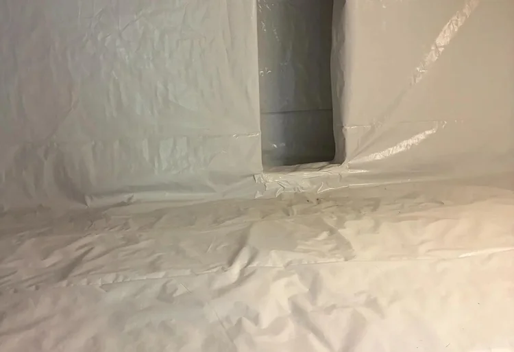 Sealed foundation vent behind crawl space wall liner in Tennessee — Crawlspace Crew
