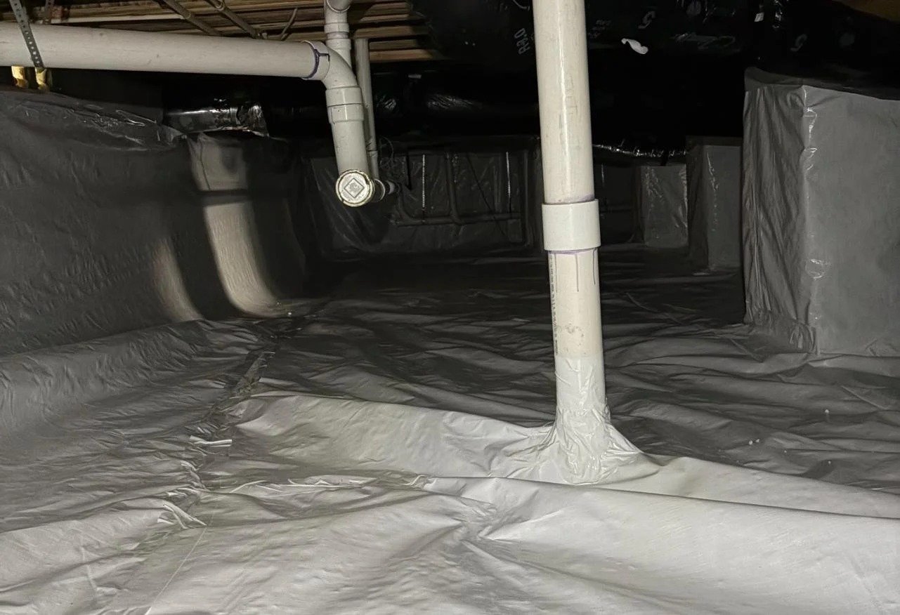 Crawl space vapor barrier sealed around plumbing Tennessee
