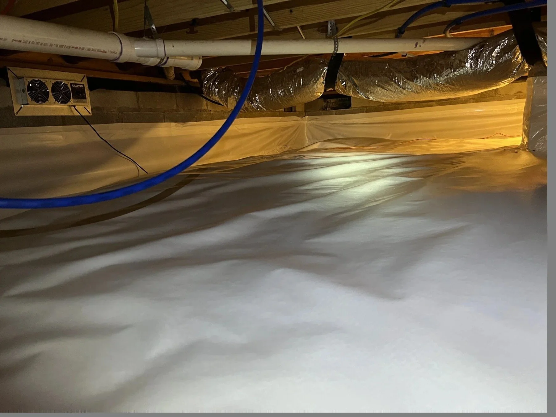 Crawl space ductwork, insulation and vent fan inspected by Crawlspace Crew in Middle Tennessee.