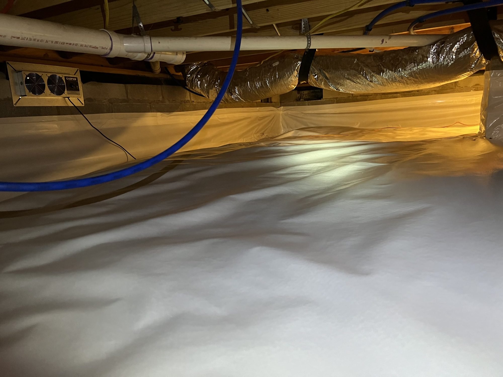 Sealed crawl space liner running past a closed foundation vent in Murfreesboro, TN