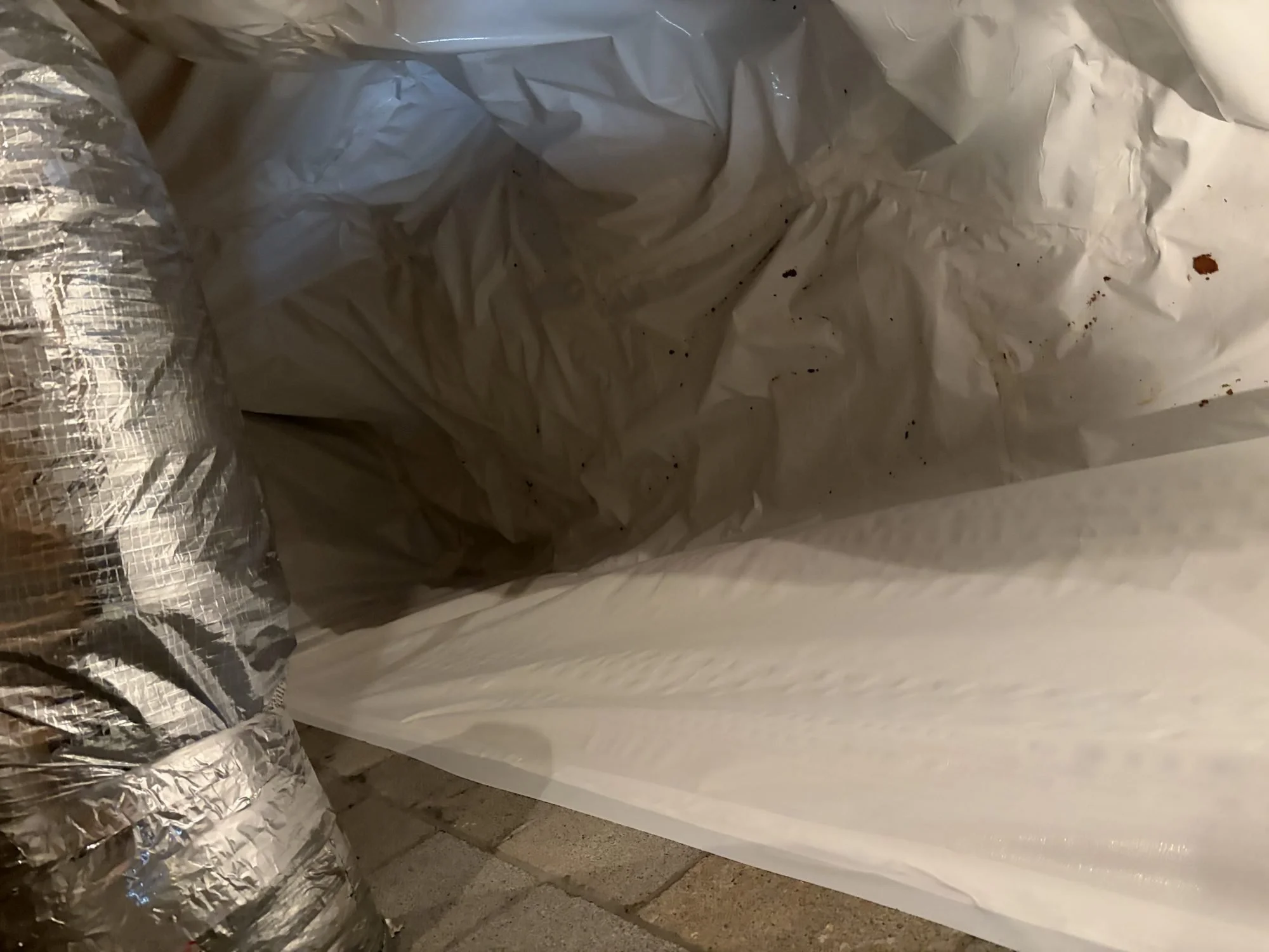 Crawl space liner sealed around HVAC ductwork on a Middle Tennessee job