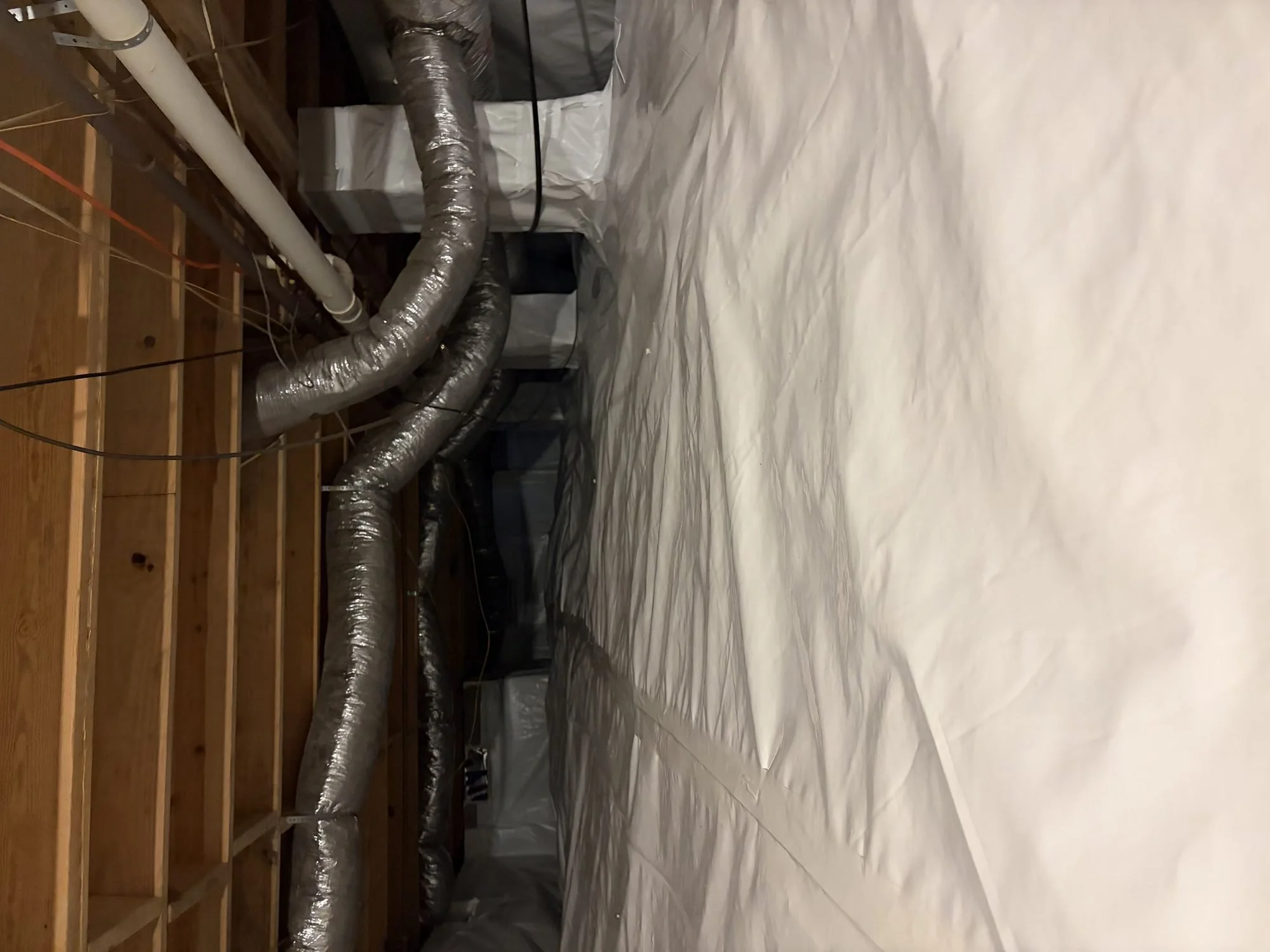 Vapor barrier carried up the foundation wall on a Murfreesboro crawl space