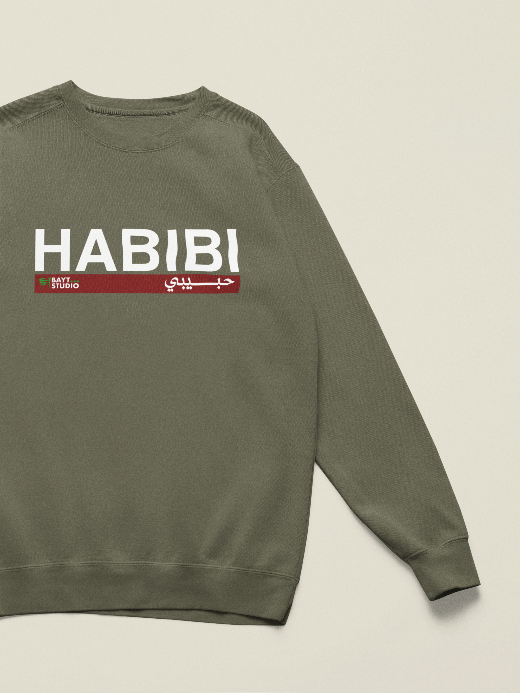 Habibi-ol-a-sweatshirt-with-a-customizable-sleeve-lying-on-a-colorful-background-m52750 8.png