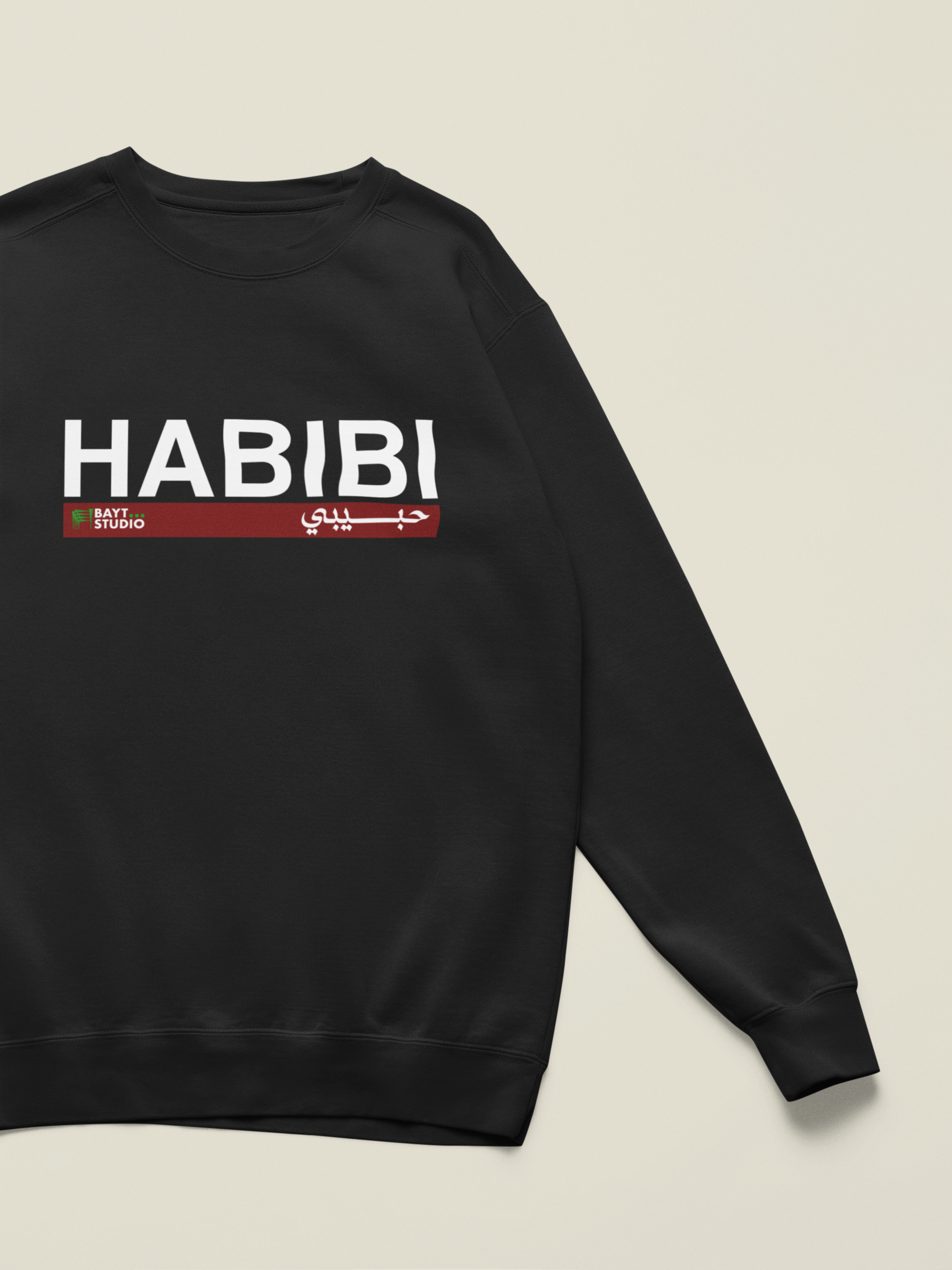 Habibi-bl-sweatshirt-with-a-customizable-sleeve-lying-on-a-colorful-background-m52750 9.png
