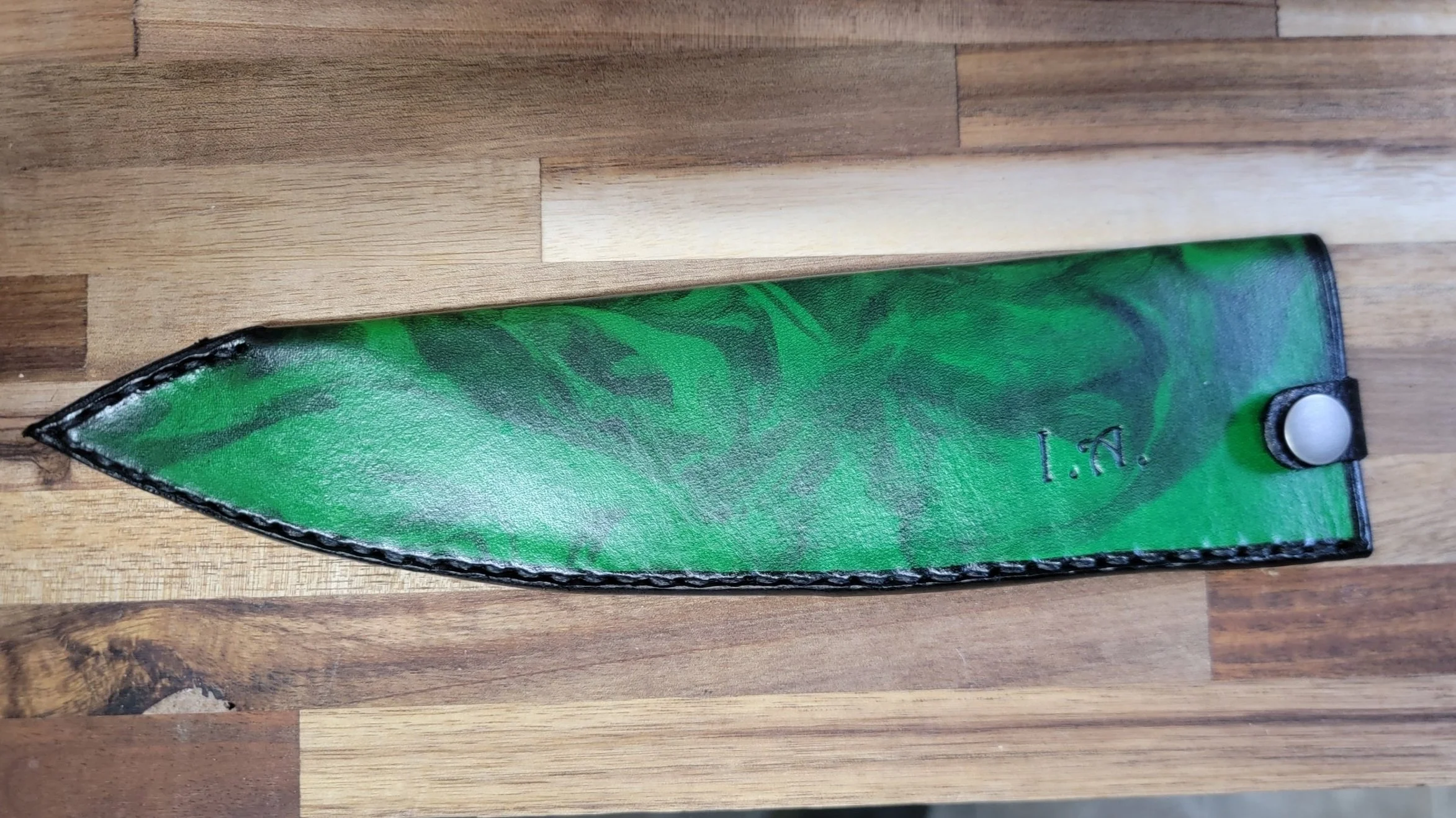 Full-size, my first marble sheath sold, with a green background, and black marble, along with a button clasp.