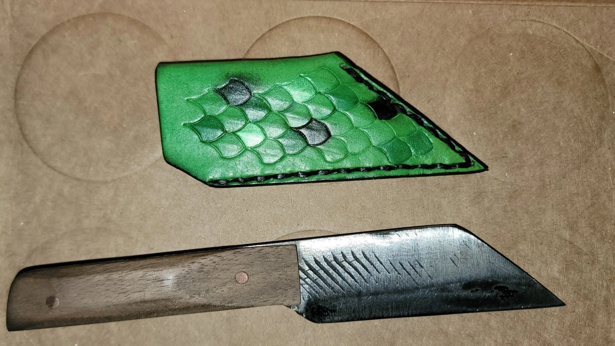 Another personal, this time mini. Kelly green base with scales stamped across most, with color variation in scales.
p.s. this is also a knife I made, quickly for the first time at my brothers house.