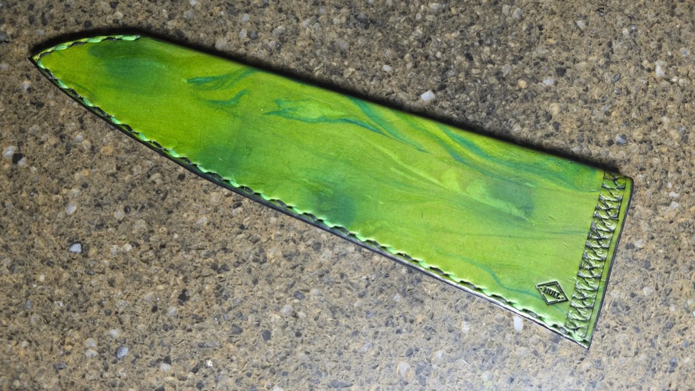 My personal 8.25" Gyuto, with a Green and Blue airbrush base, and Blue Marbling, along with the Teeth edge stamping, and my new "Maker stamp"
