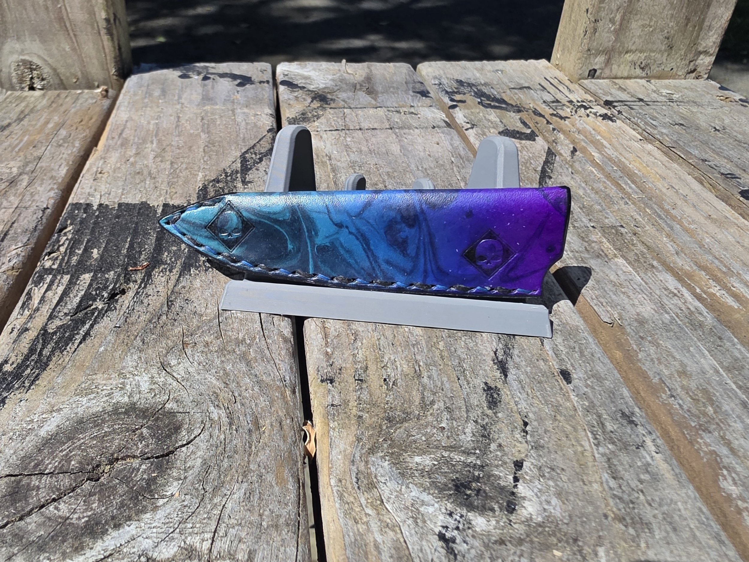 A Mini and Full-size custom set, with a blue to Purple fade base and Black marbling overtop, and a couple skull stamps.