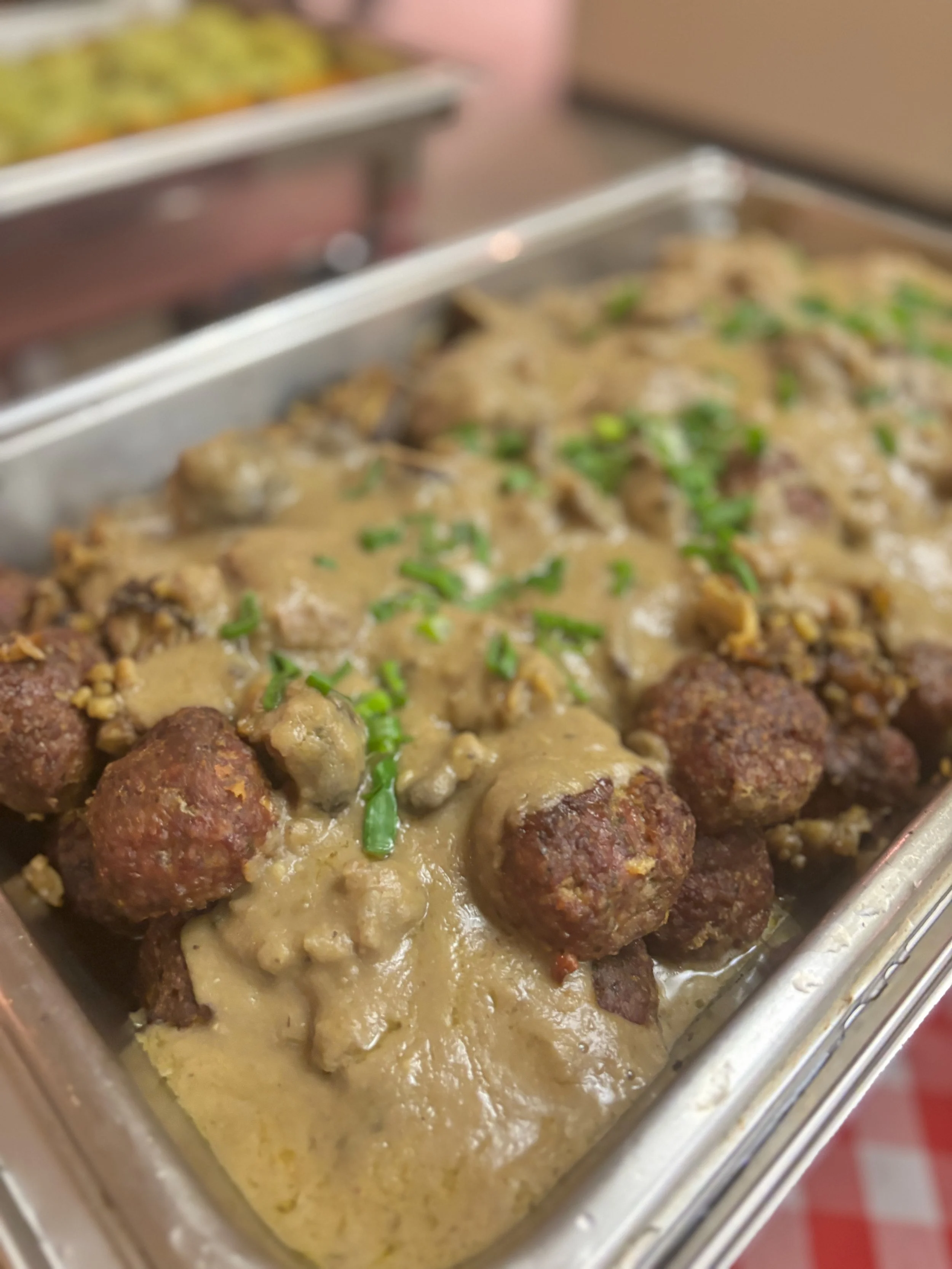 Tray of Beef Meatballs with Mushrooms and Chestnut Cream Sauce.