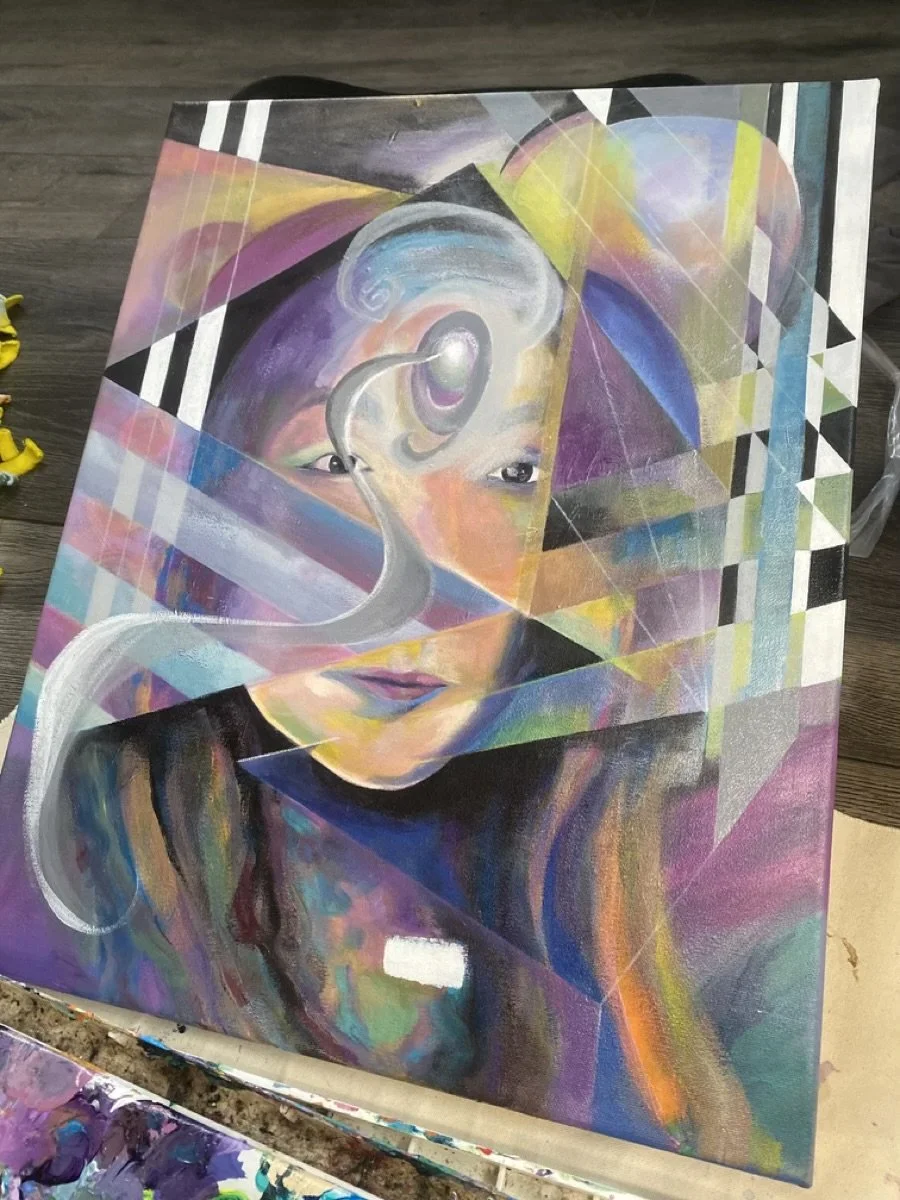 An abstract painting of a woman's face with geometric shapes, colorful swirls, and a white serpent.