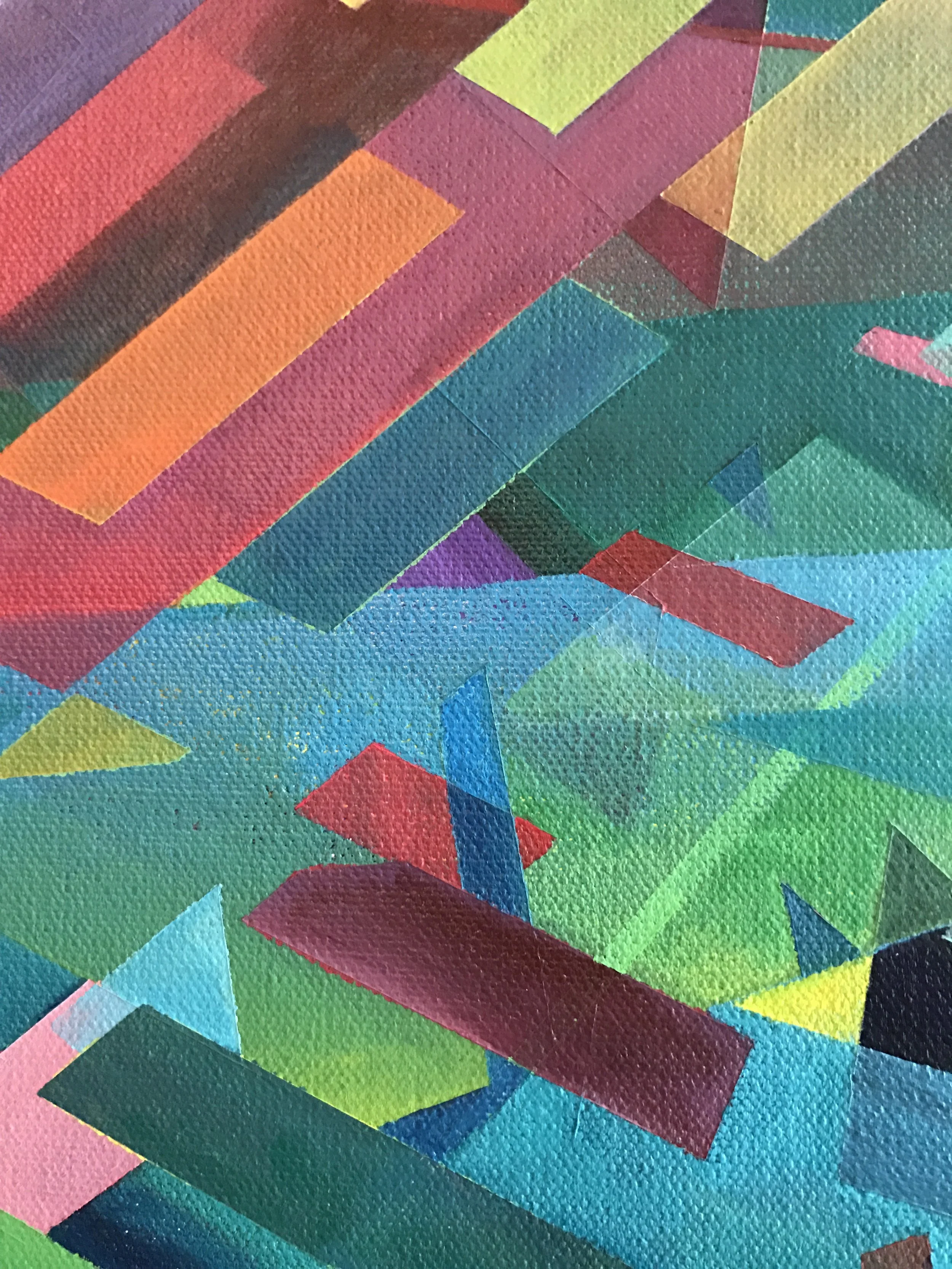 Close-up view of a colorful, abstract geometric pattern on a textured surface, featuring various overlapping shapes and vibrant colors including red, orange, yellow, green, blue, and purple.