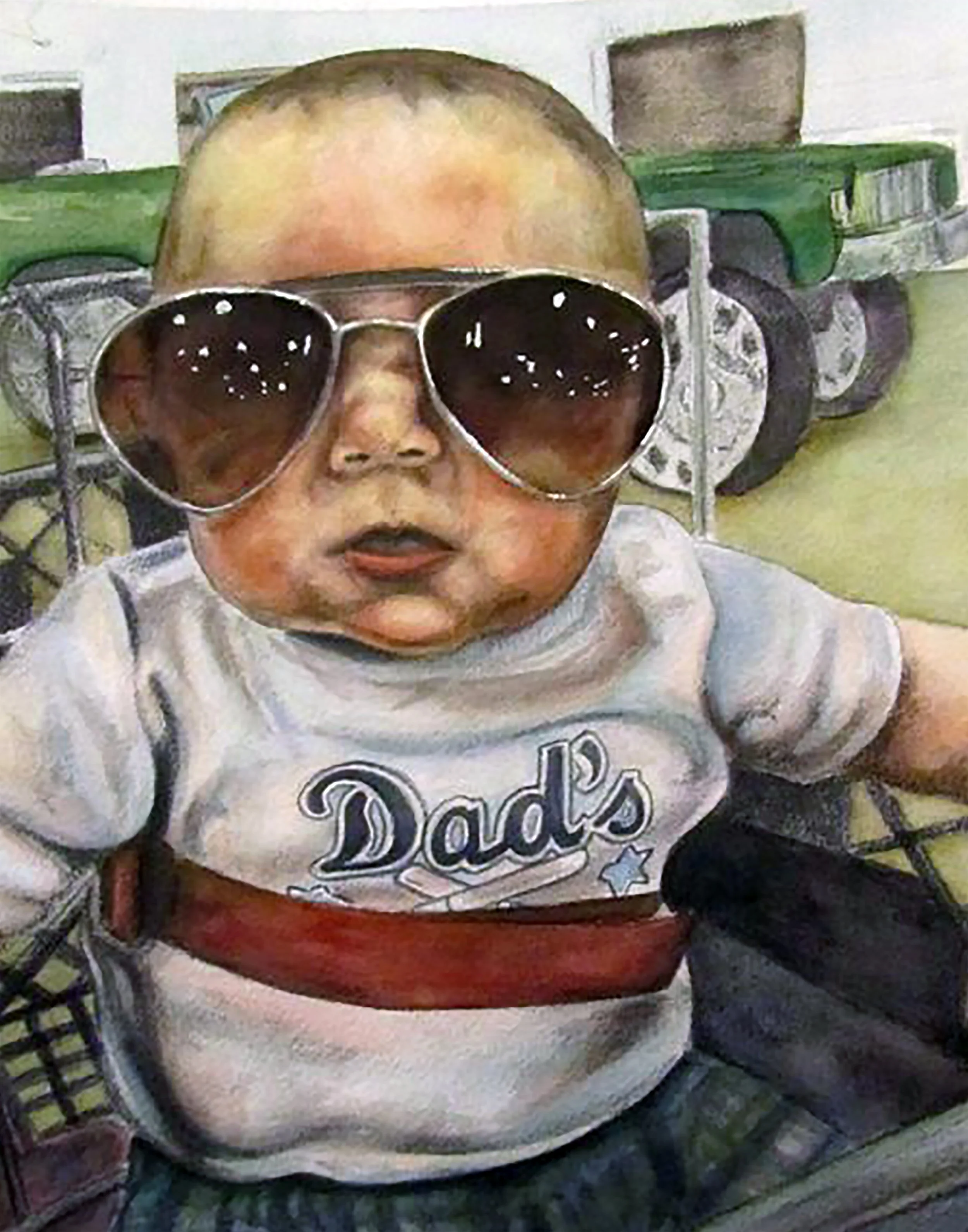 A baby wearing large sunglasses and a t-shirt with the words 'Dad's' on it, sitting in a chair with a green toy truck in the background.