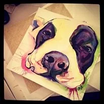 Painting of a black and white dog with pink blush on cheeks and a green collar
