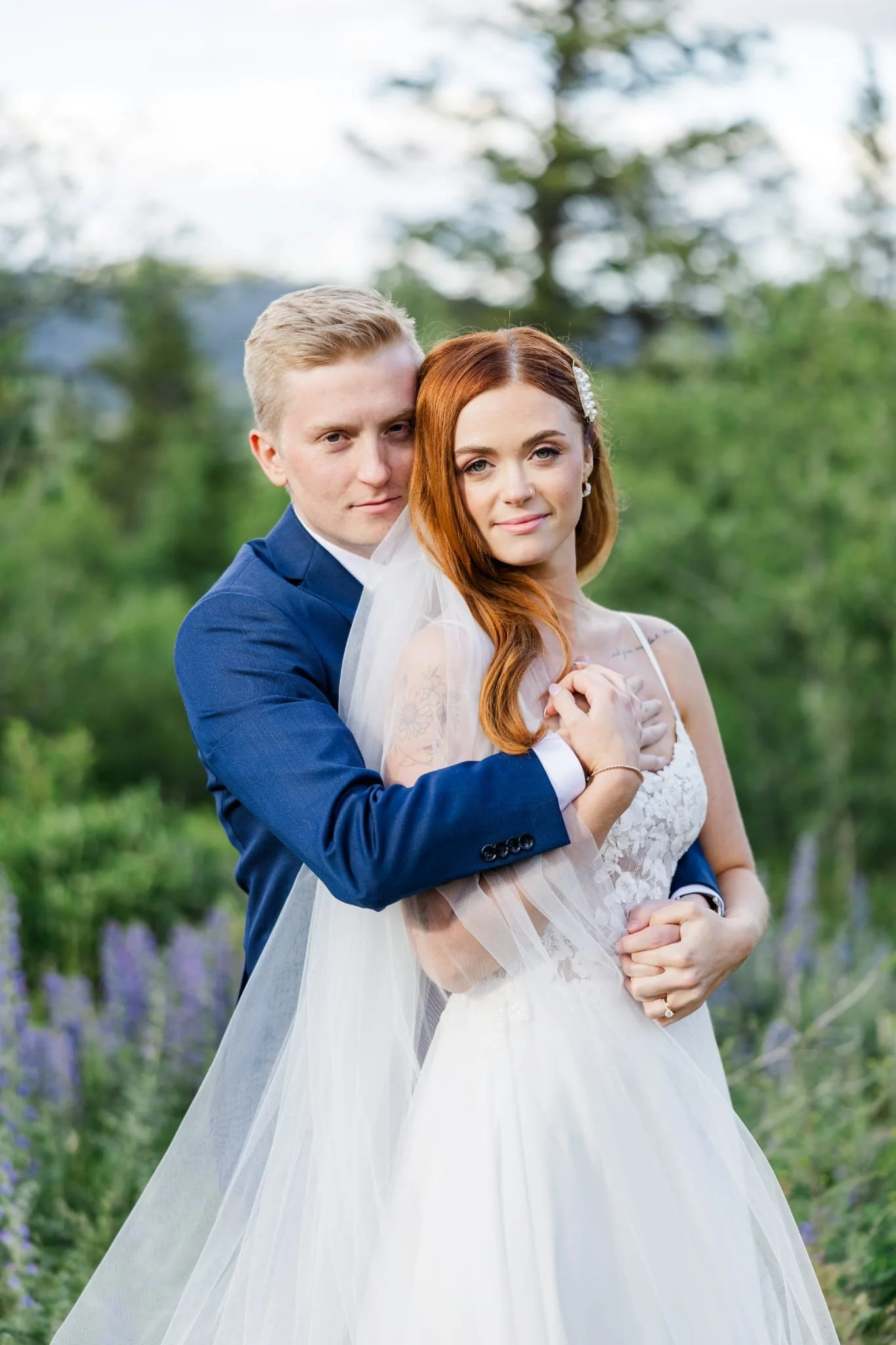 Bride and groom embracing in a classic outdoor portrait