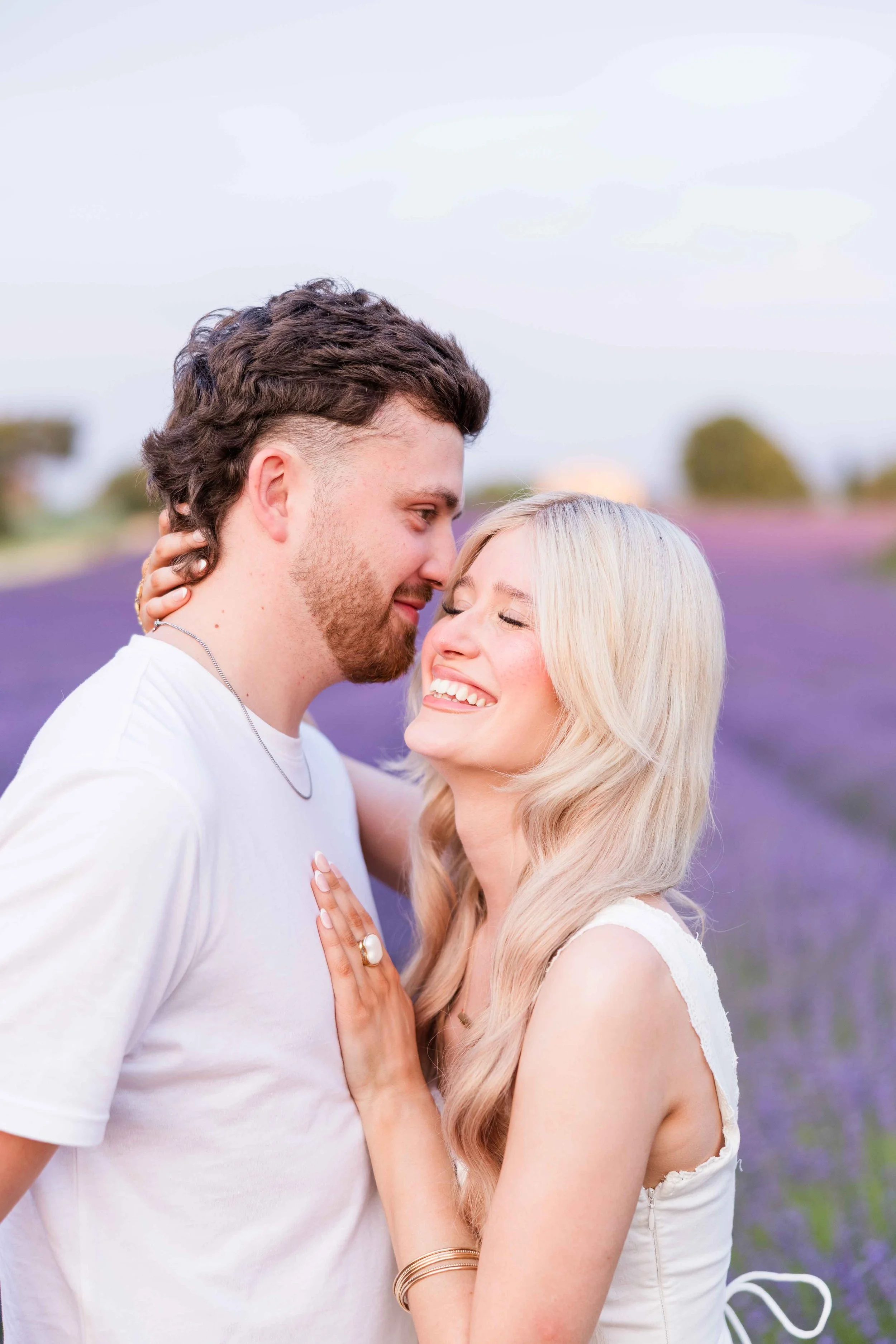  Romantic close-up of a couple in a lavender field in Provence at sunset. 