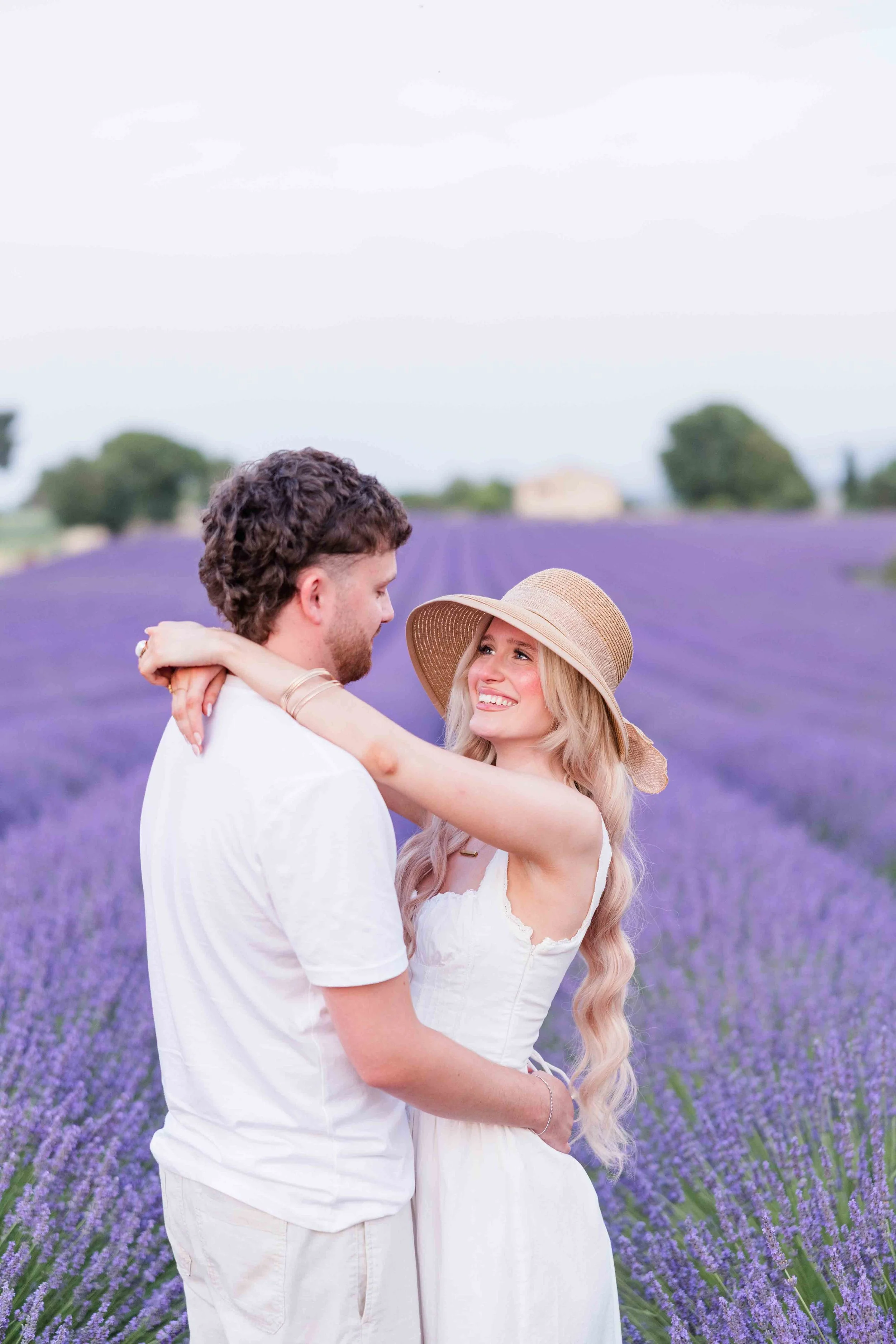  Romantic close-up of a couple in a lavender field in Provence at sunset. 