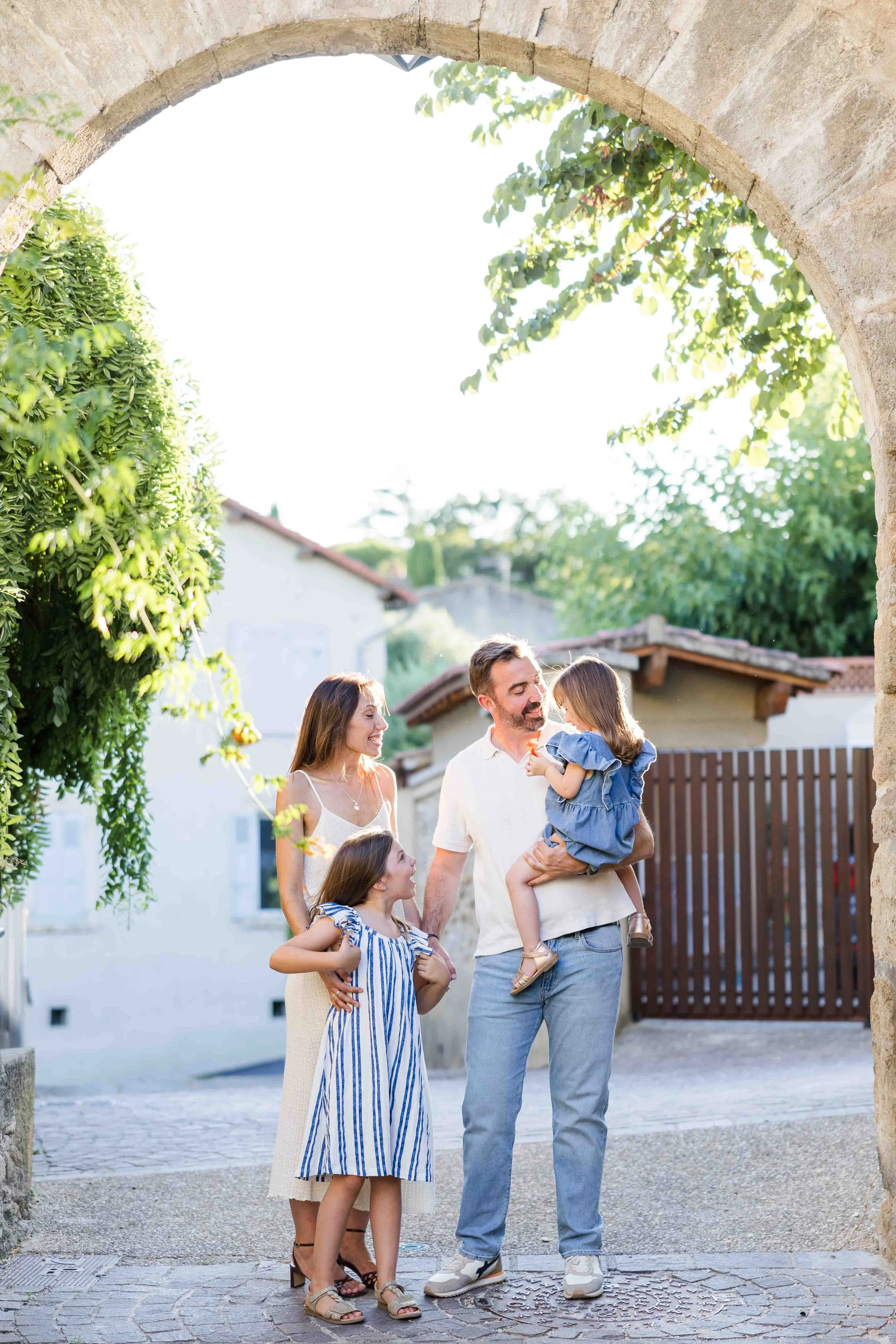 Family Portrait Under a Stone Arch