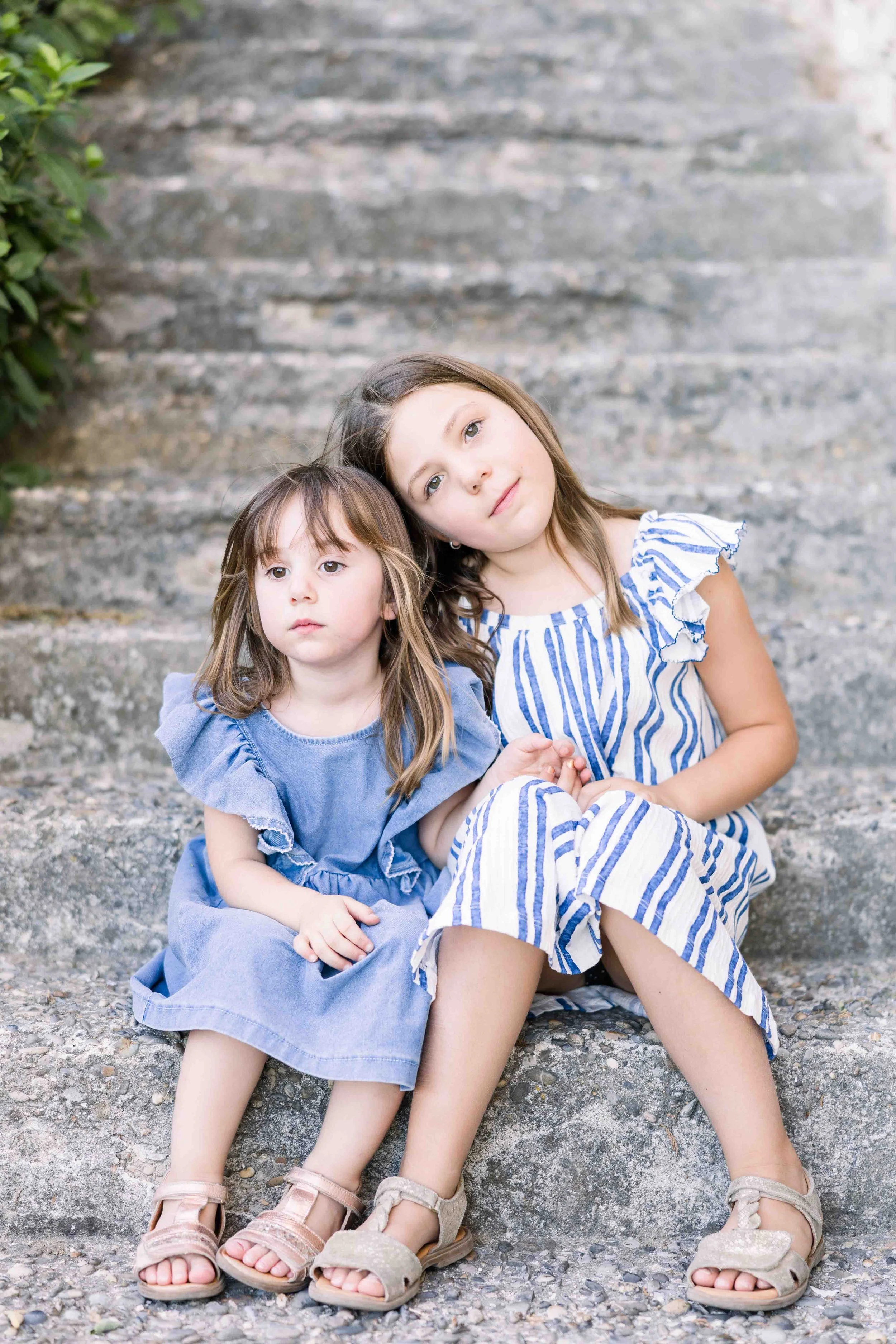 Sisters Sitting on Stone Steps