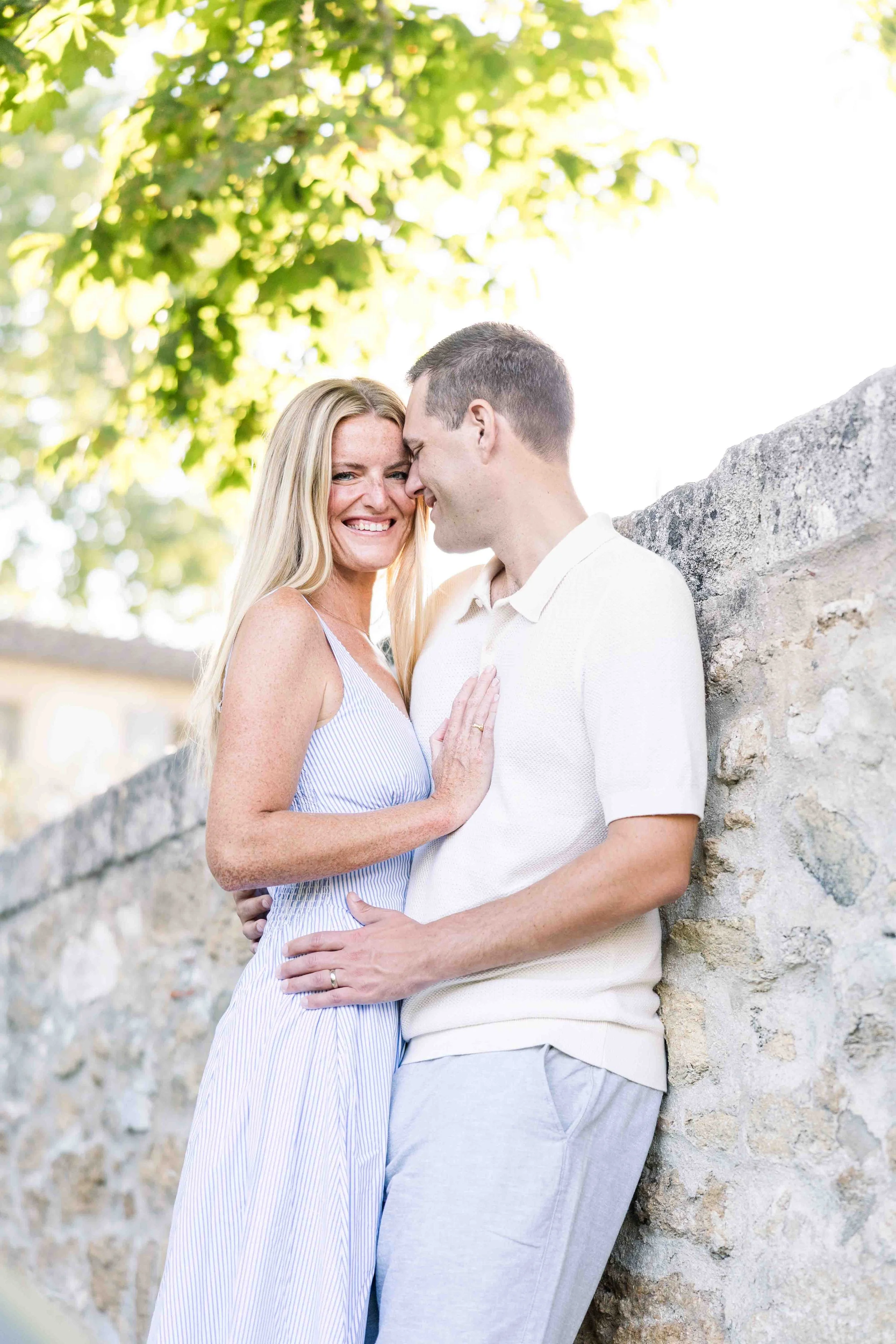 Romantic portrait by the stone wall