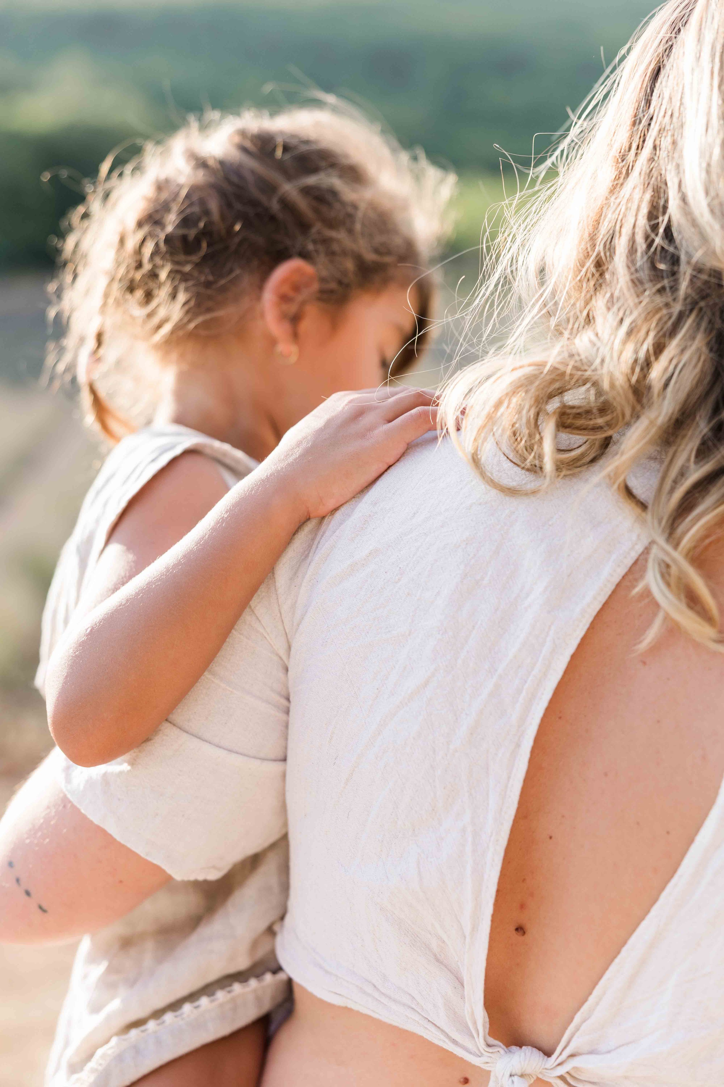 Mother and daughter cuddles in Provence