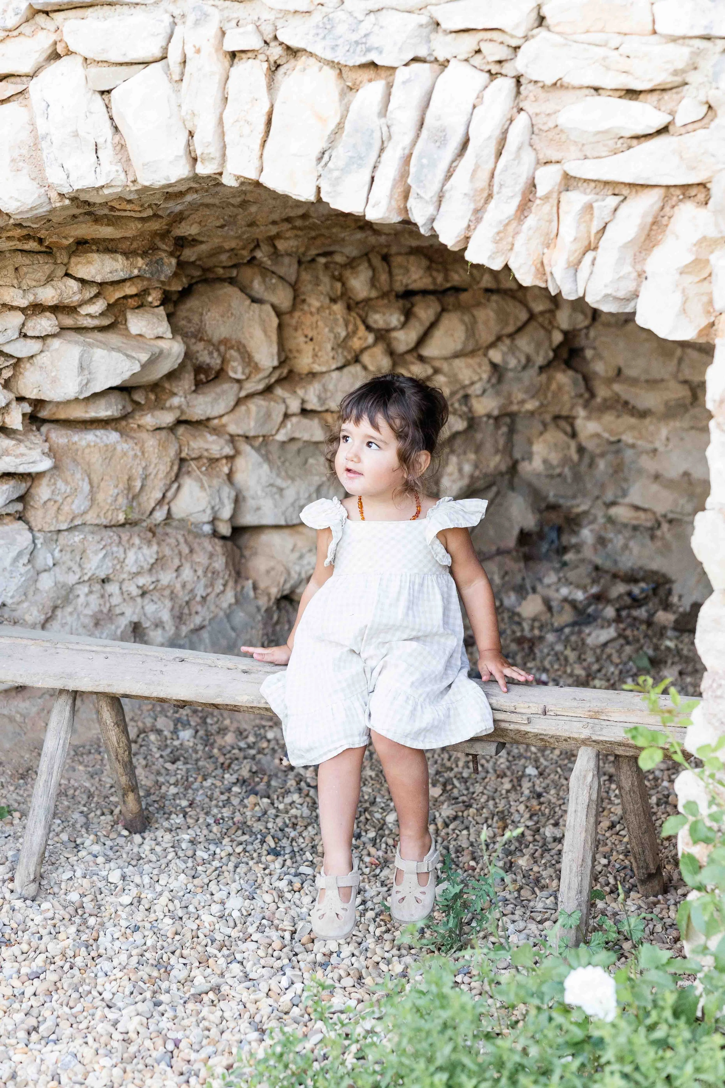 Provence Family Photoshoot – Child Portrait Under Stone Archway