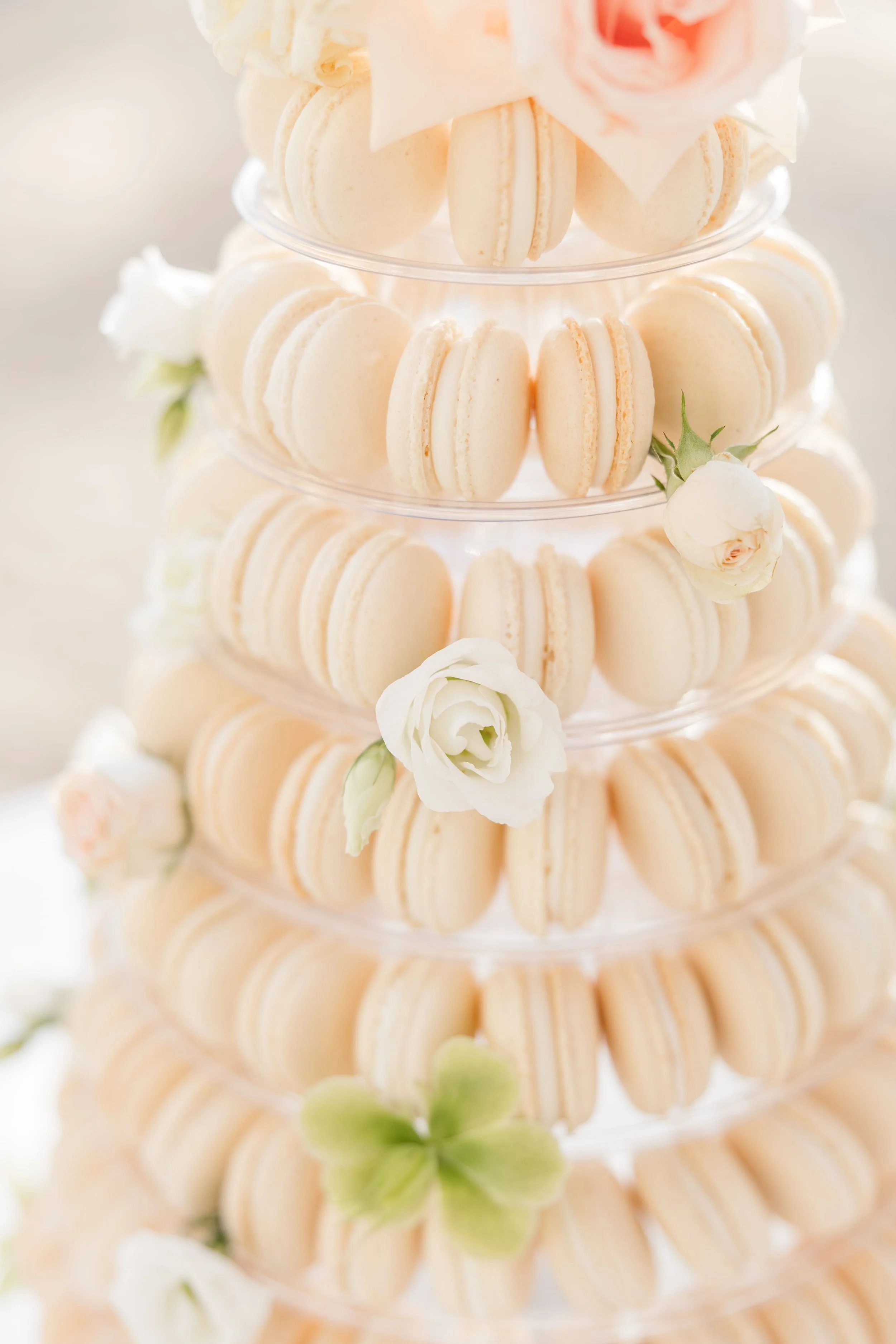 Elegant macaron wedding cake tower displayed at a luxury wedding reception