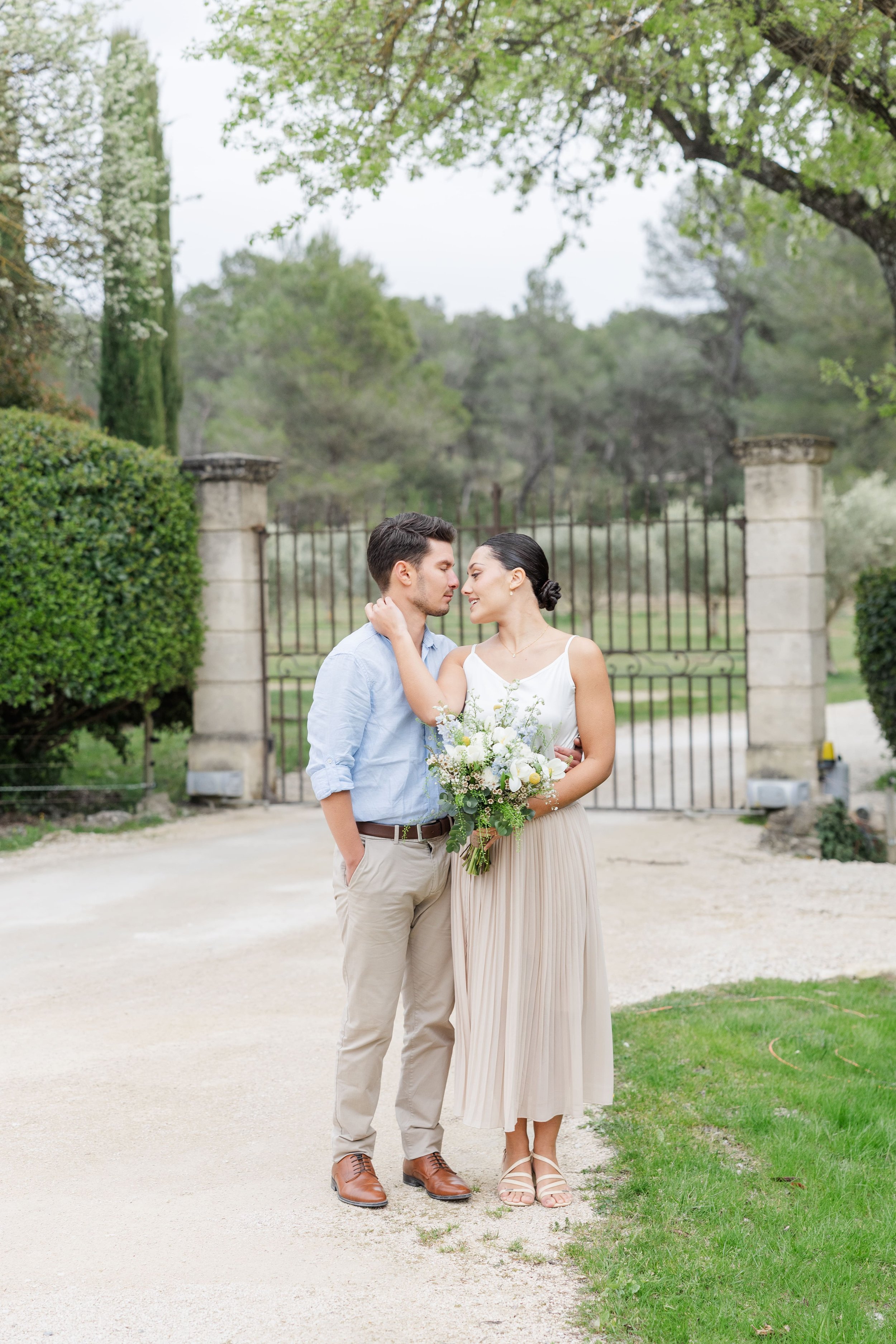 Dreamy engagement portrait of couple surrounded by Provence landscapes