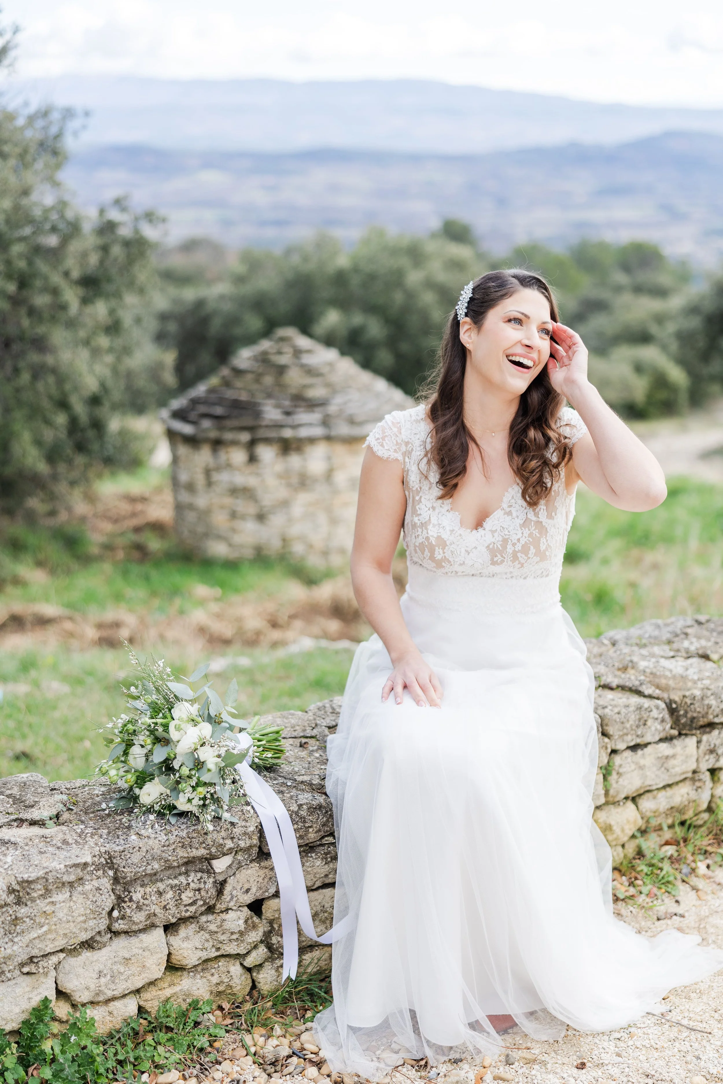 bride smiling at her bridesmaid in Gordes South of France