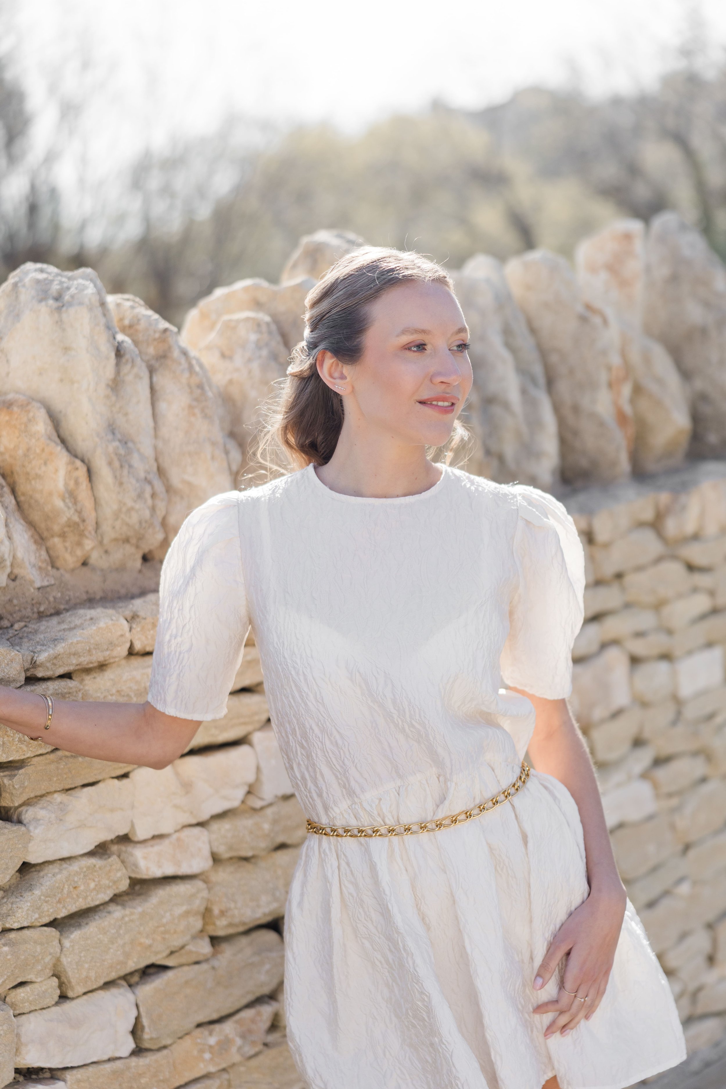 Close-up portrait of a woman with a relaxed expression in a villa in Gordes