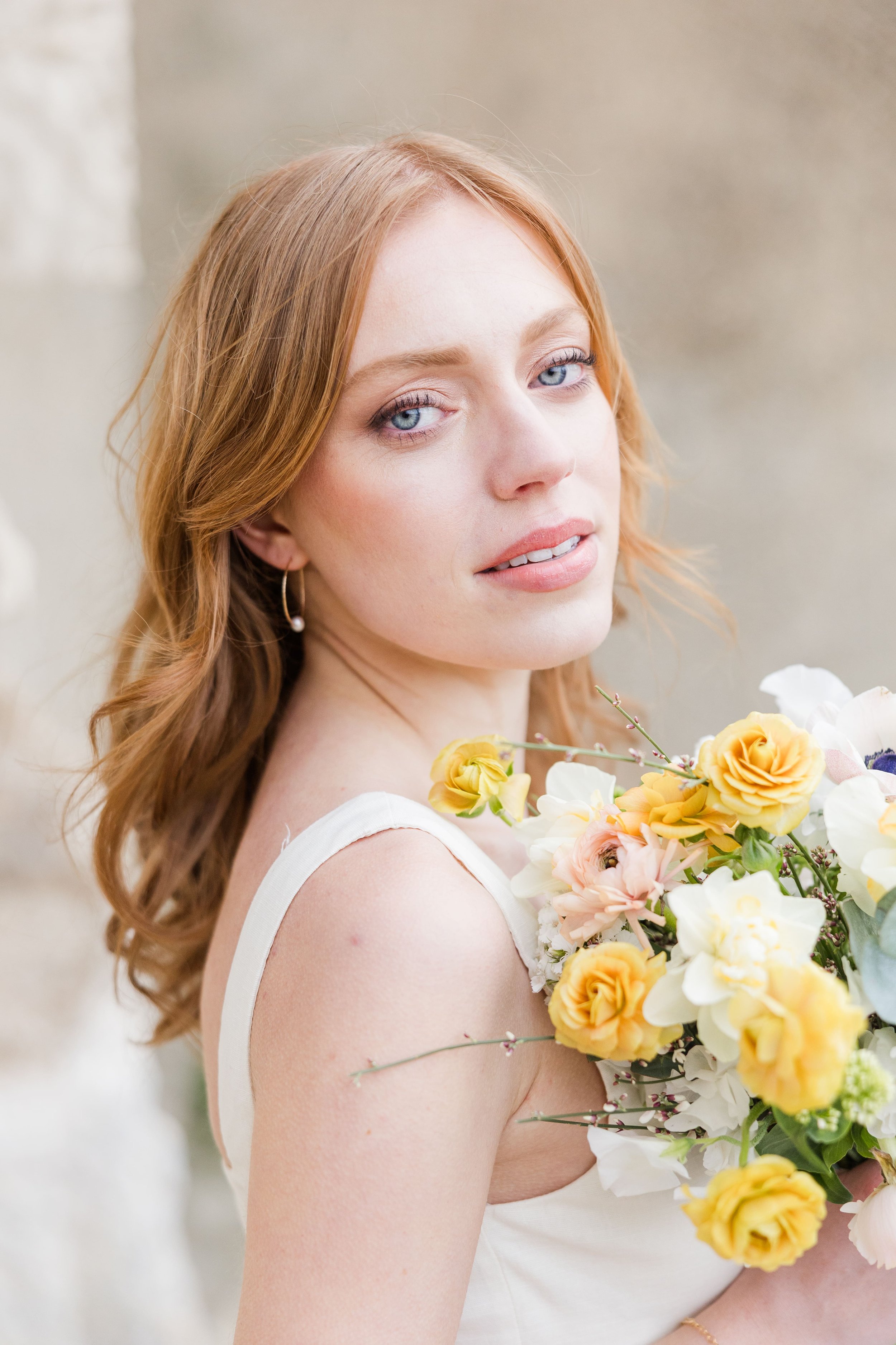 Romantic Provence scene with woman holding flowers in a stone village street