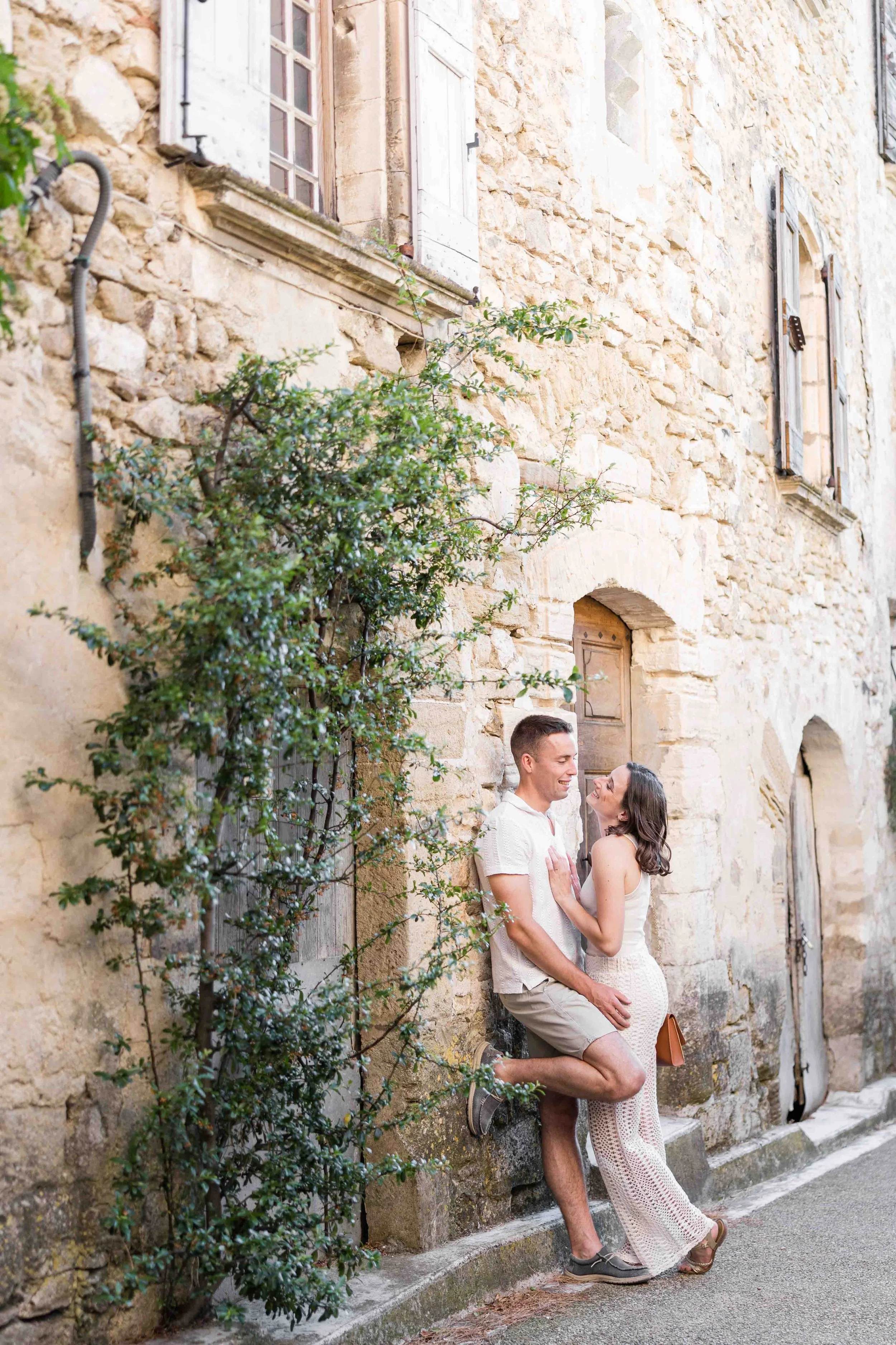 Couple portrait in provencal street village of venasque in Provence