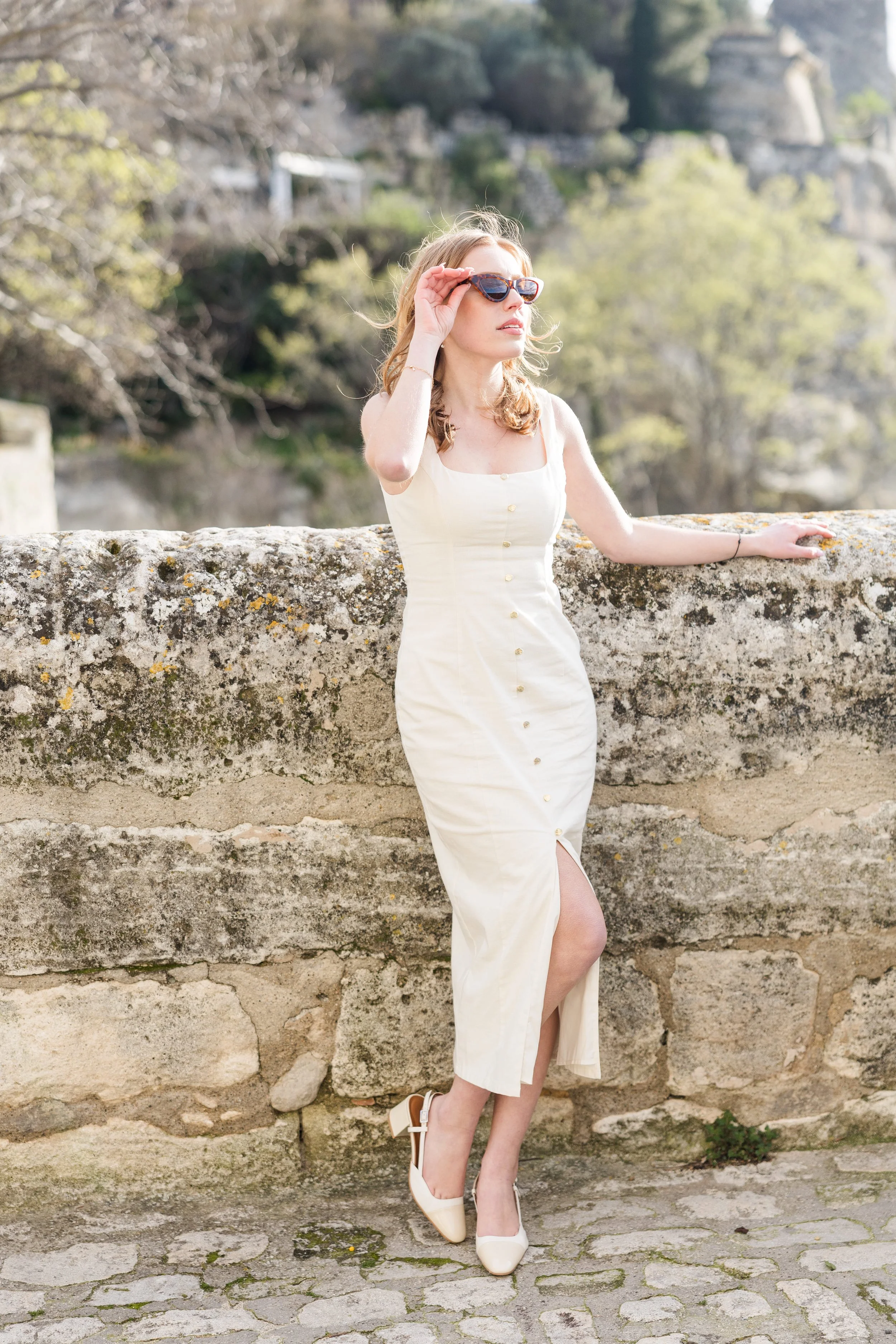 Romantic Provence scene with woman in a historic stone street
