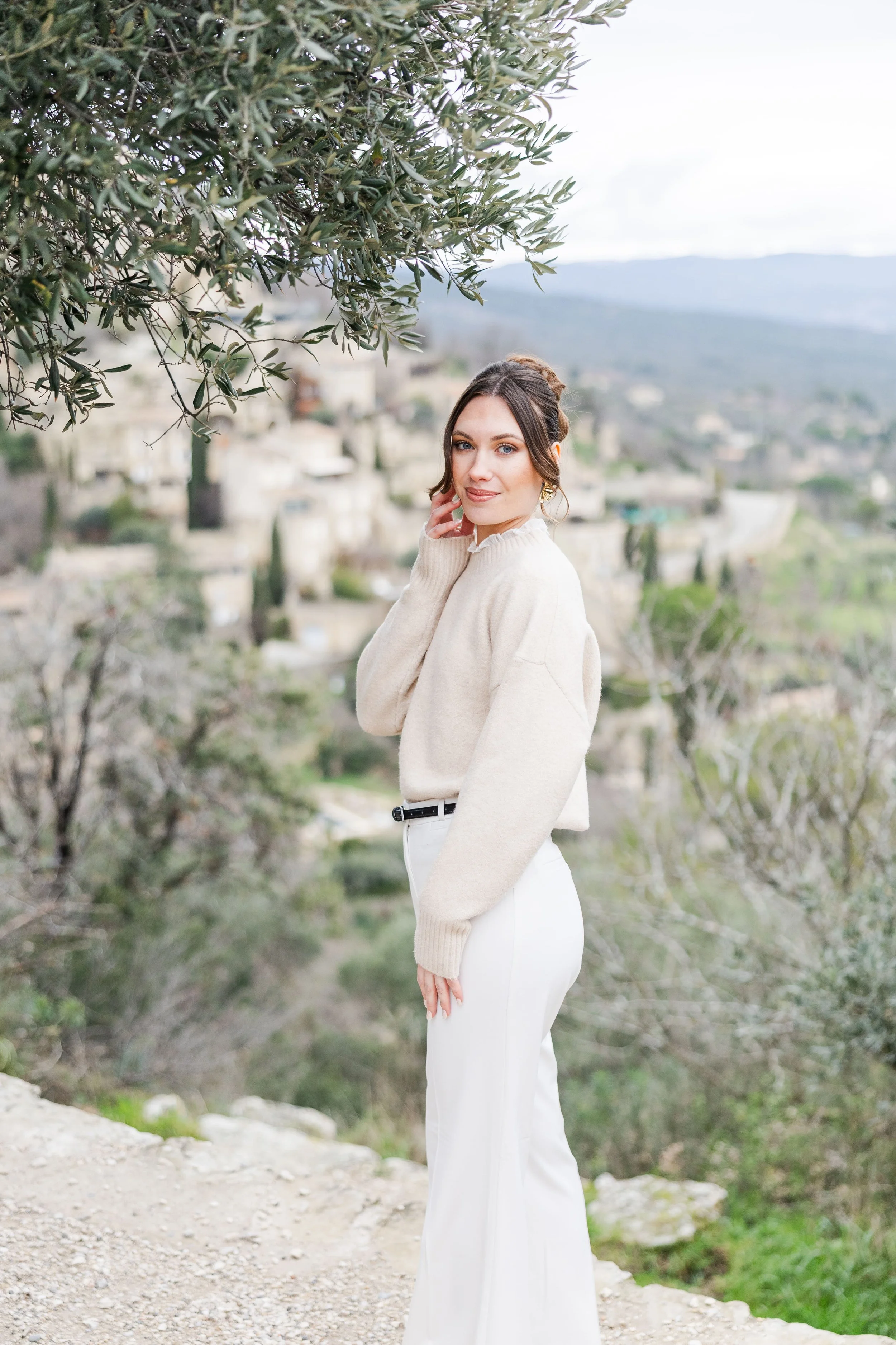 Timeless portrait of a solo traveler in Gordes during golden hour in Provence