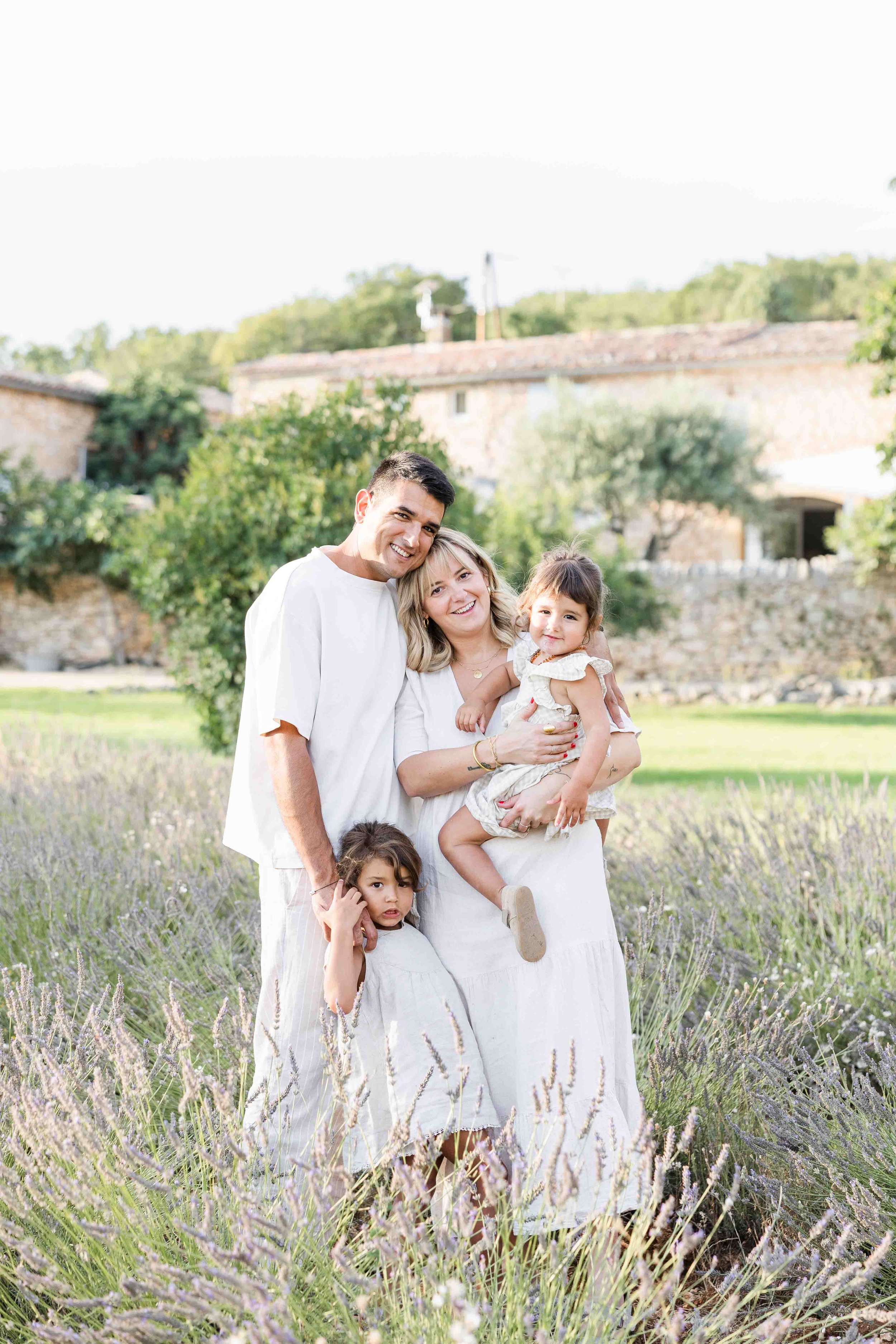 Familly runninh in a lavender field in Provence during sunset