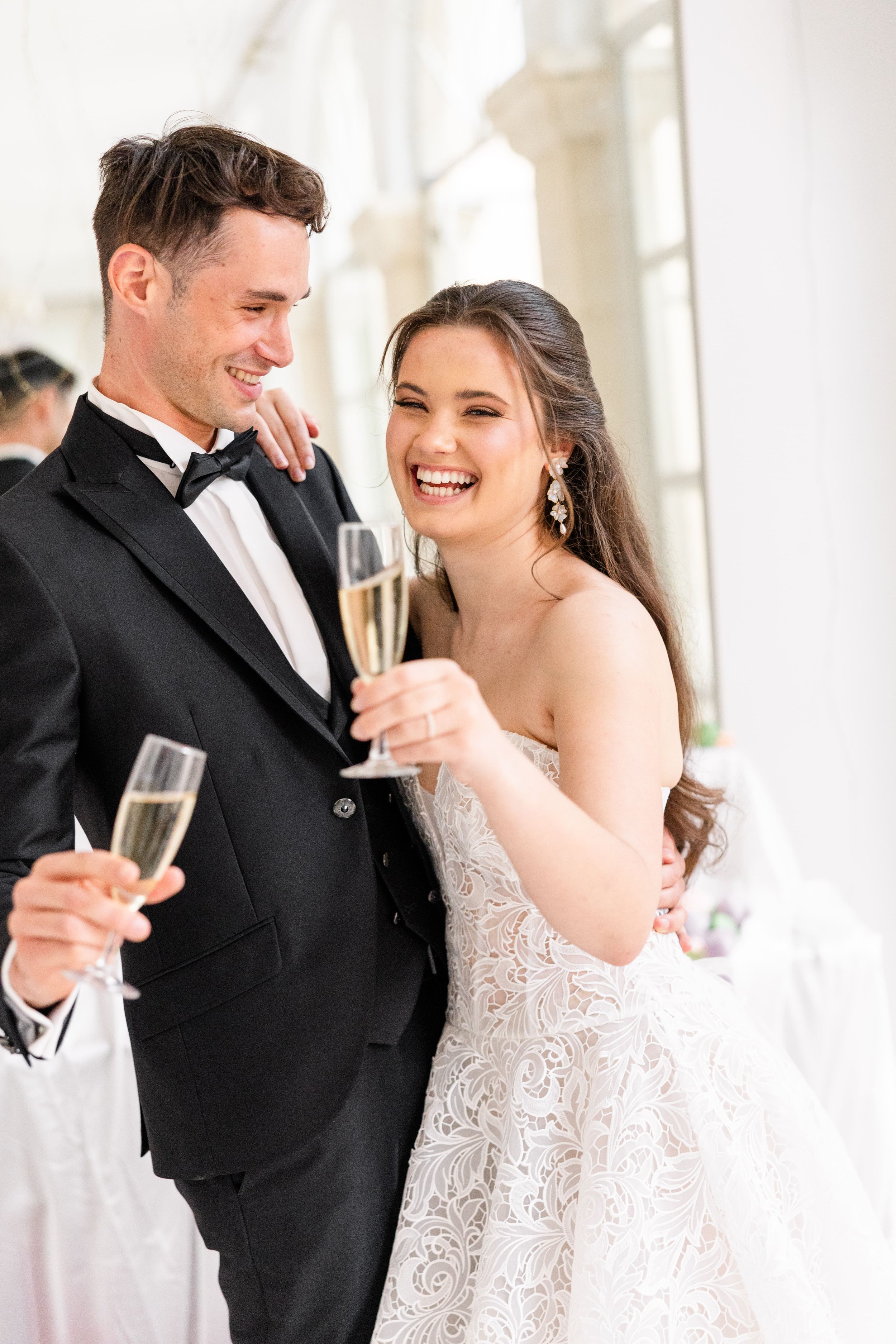 Romantic wedding couple toasting champagne during a luxury destination wedding in Provence , capturing emotion, connection, and celebration.