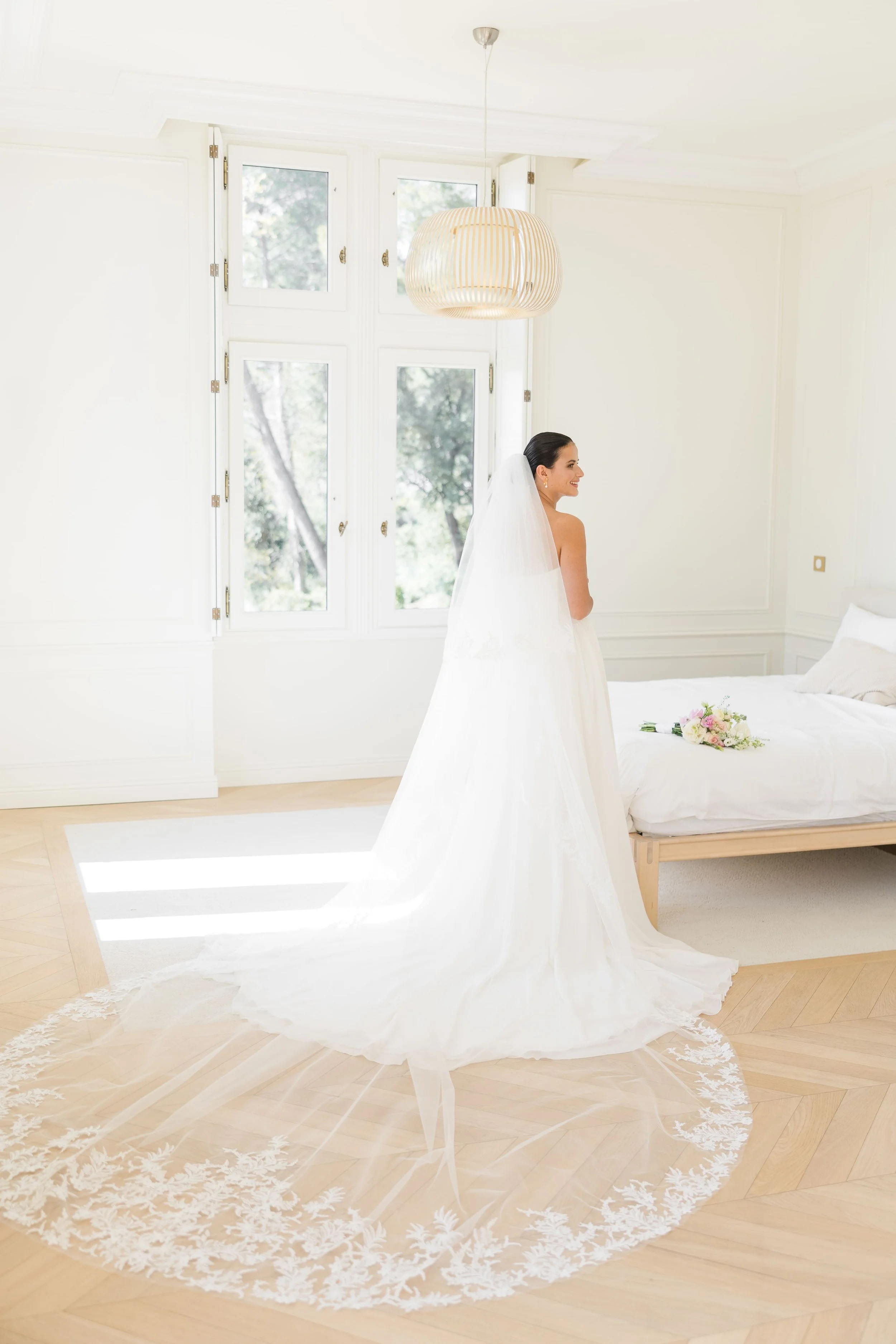 Romantic bridal portrait with long train flowing behind the bride