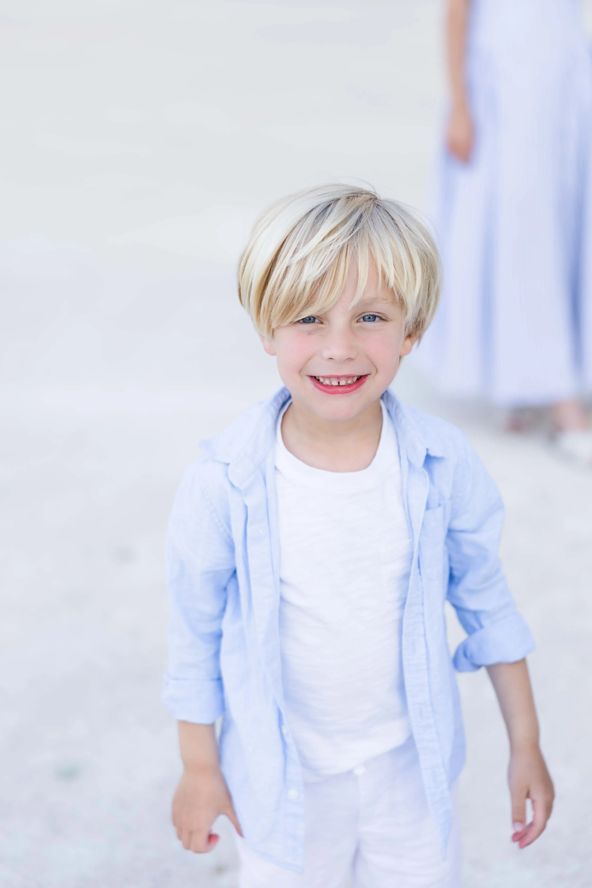Smiling young boy portrait during a family session at Château de Fonscolombe, Provence.