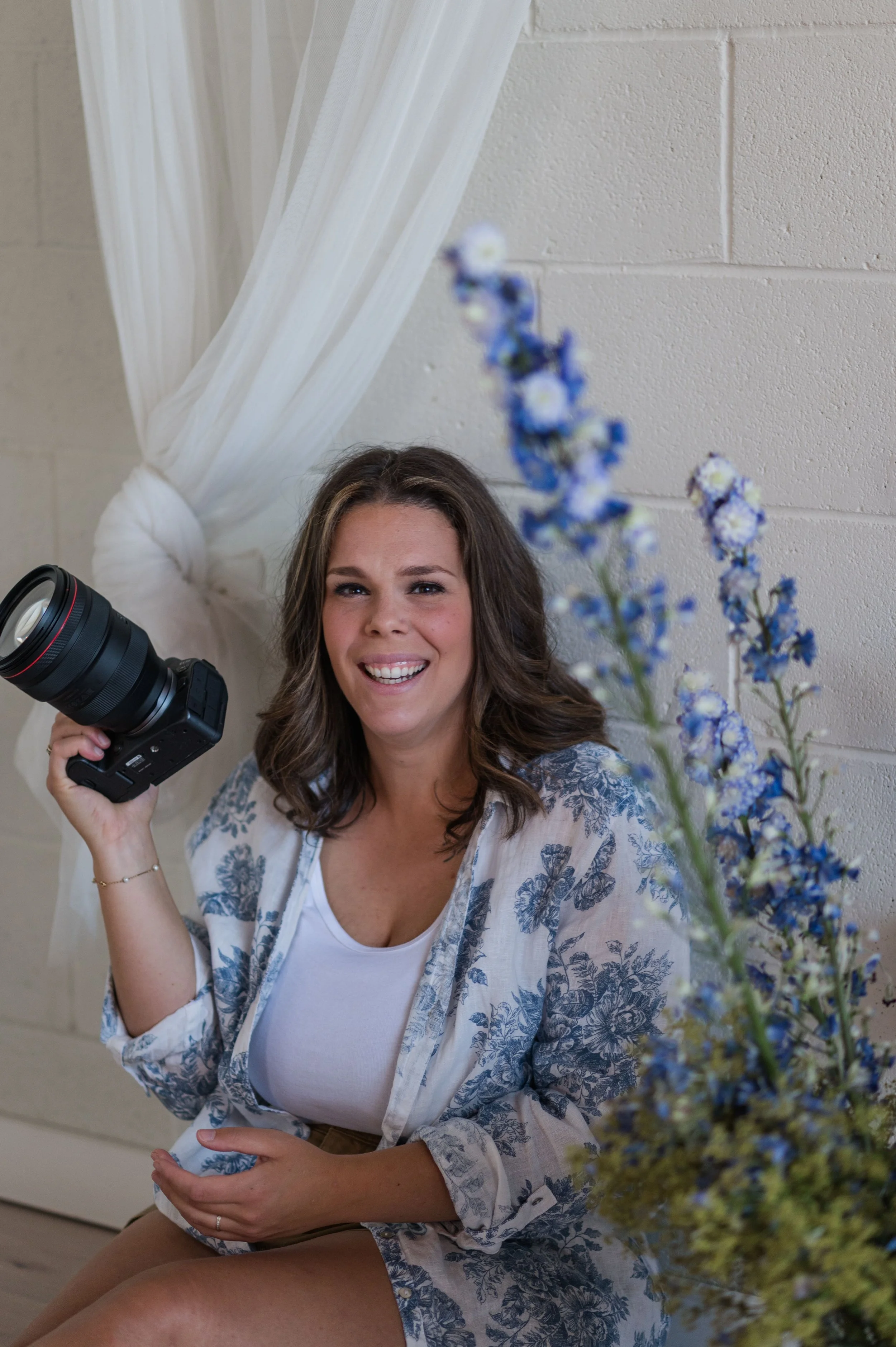 rpovence french photographer holding her camera and laughing