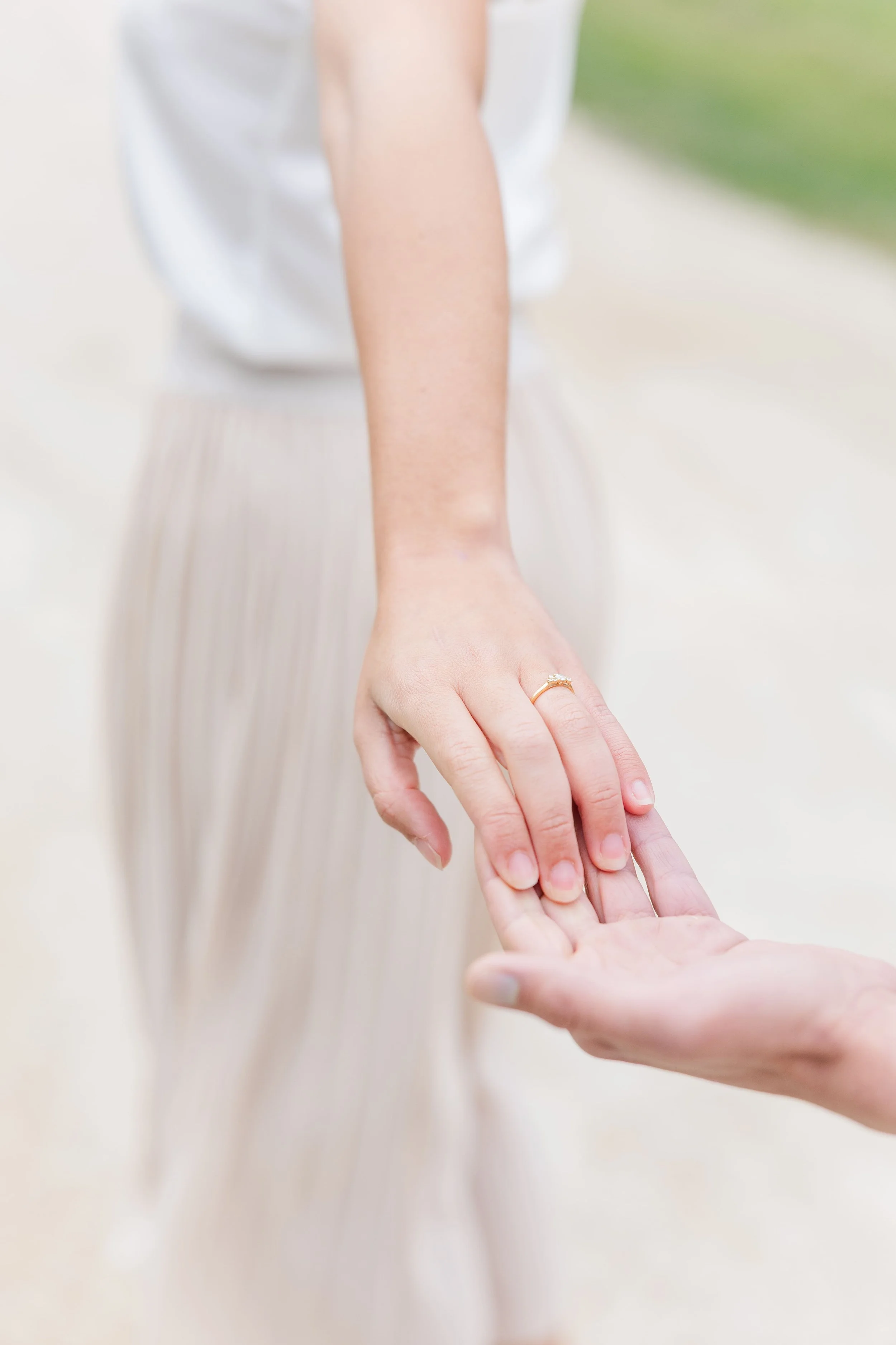 Newly engaged couple walking hand in hand during a dreamy photoshoot in Provence