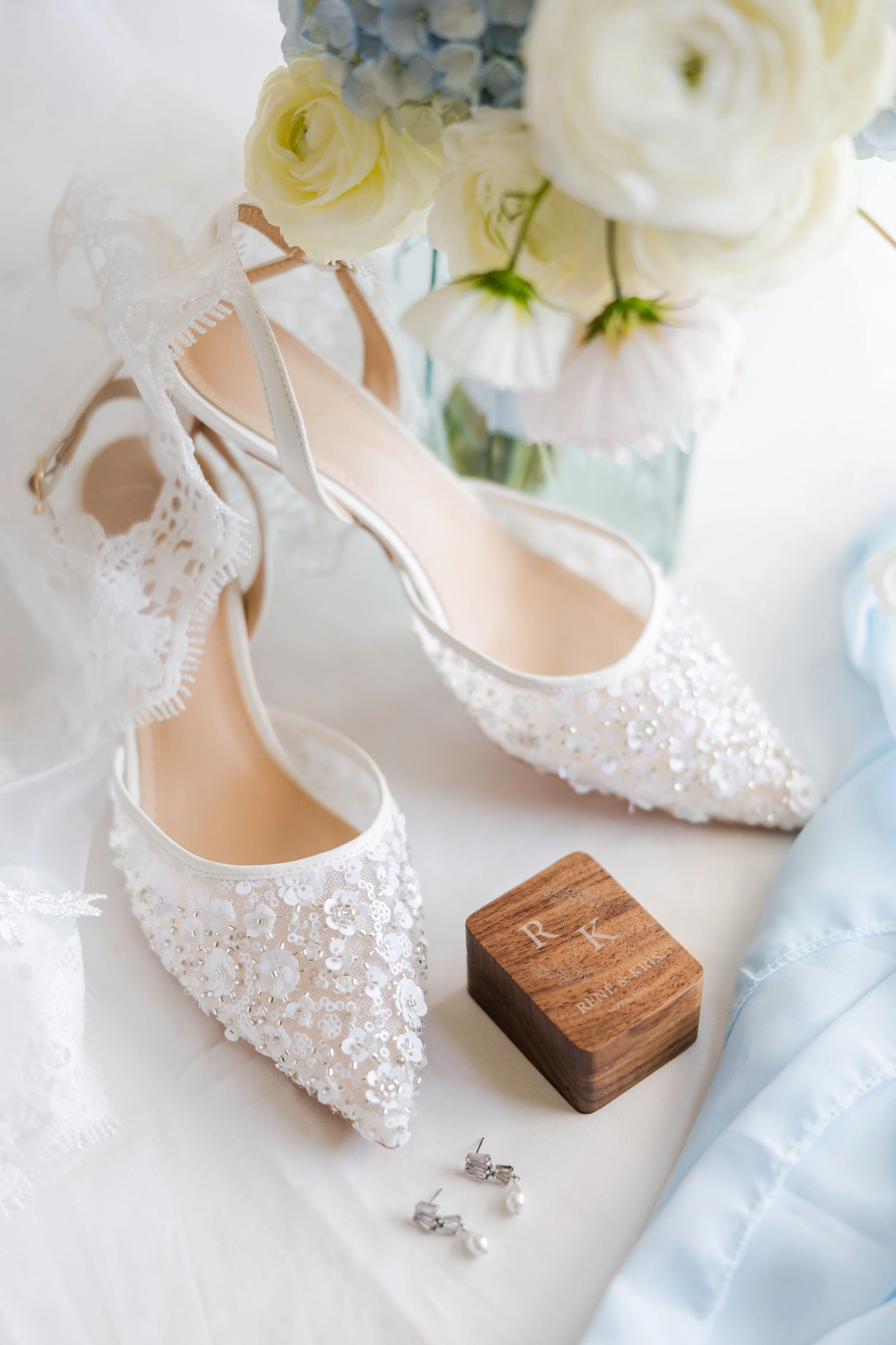 flatlay of shoes ring and earings
