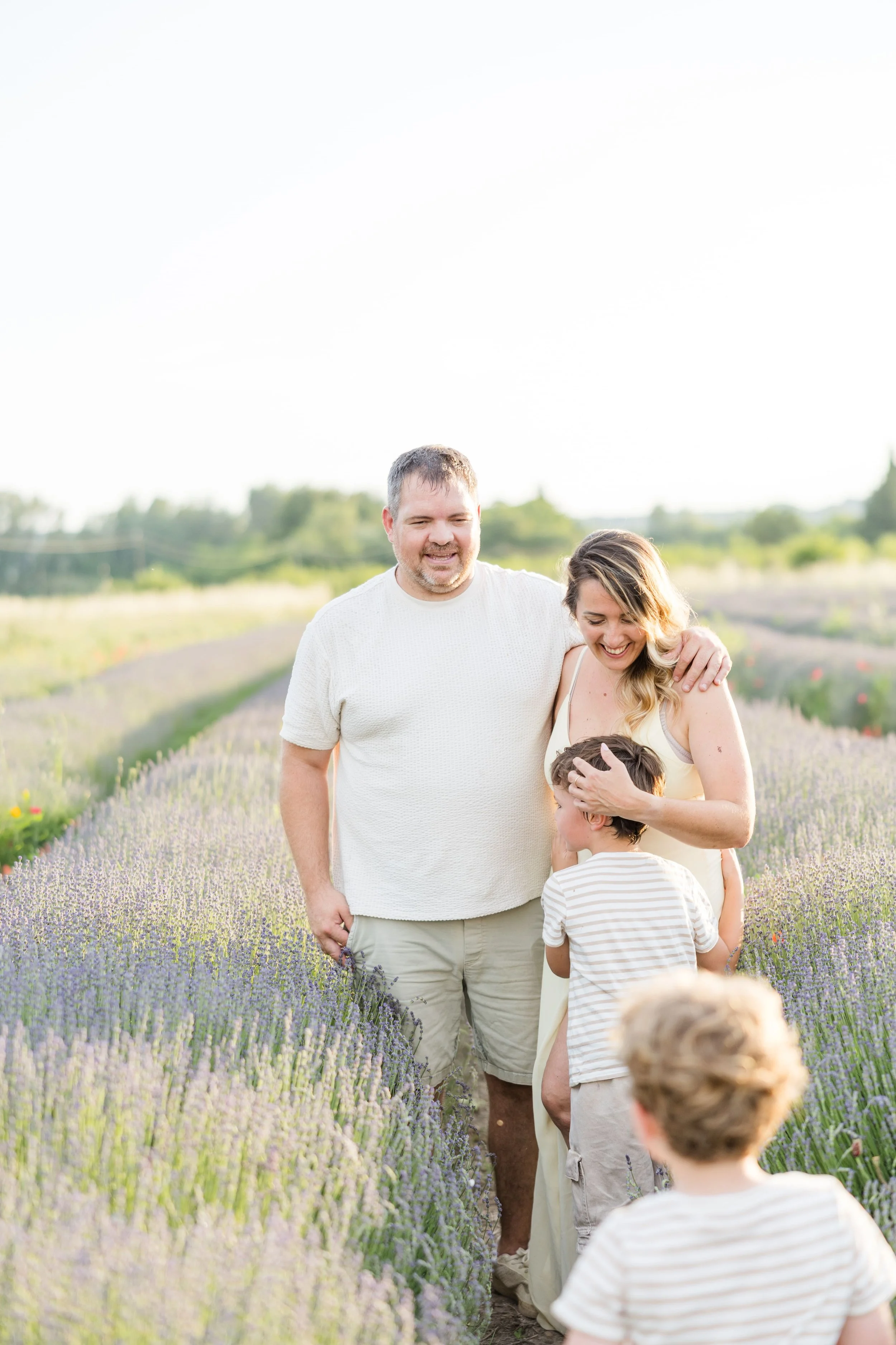Familly runninh in a lavender field in Provence during sunset