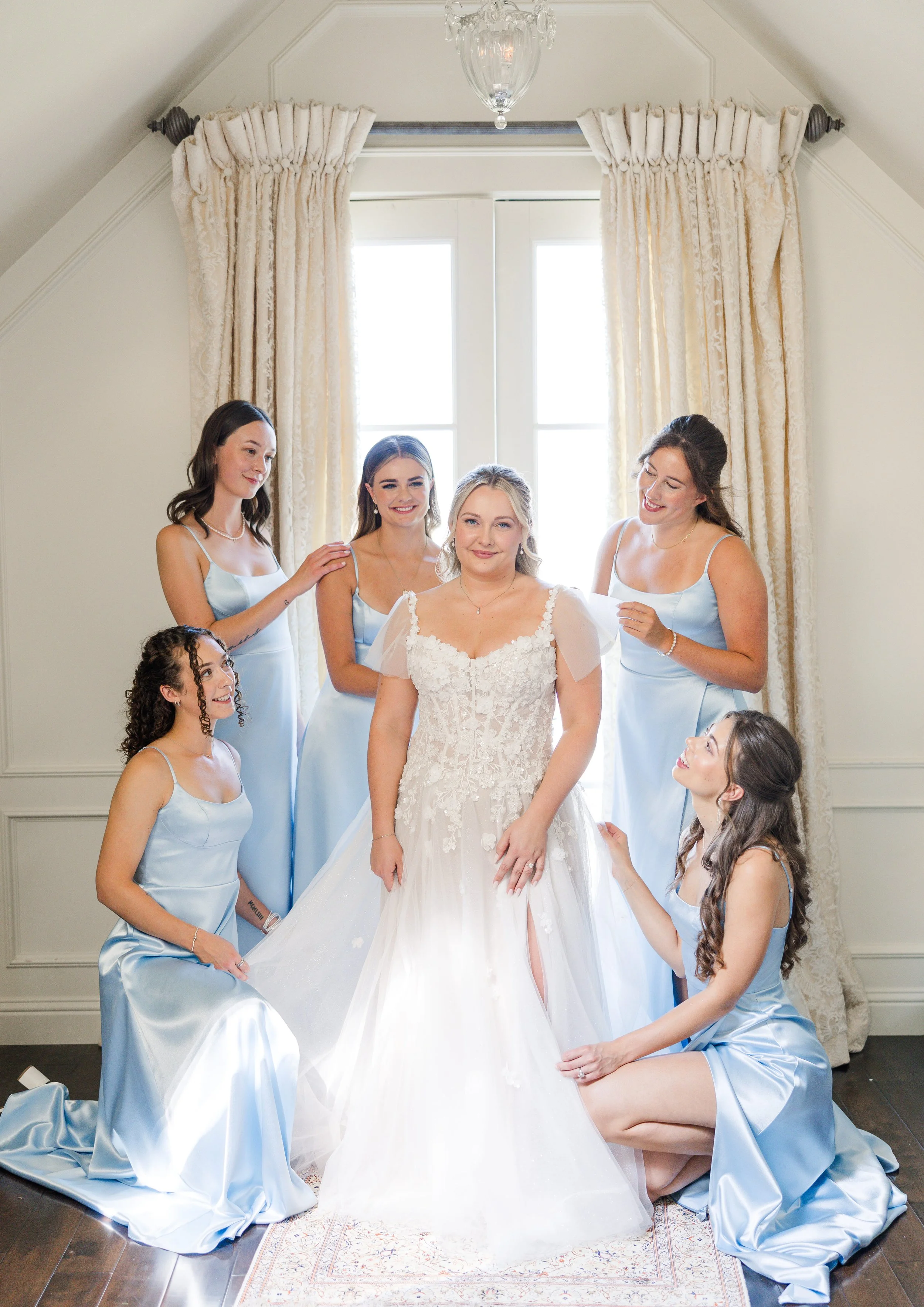 Bridal party getting ready with the bride in the wedding suite