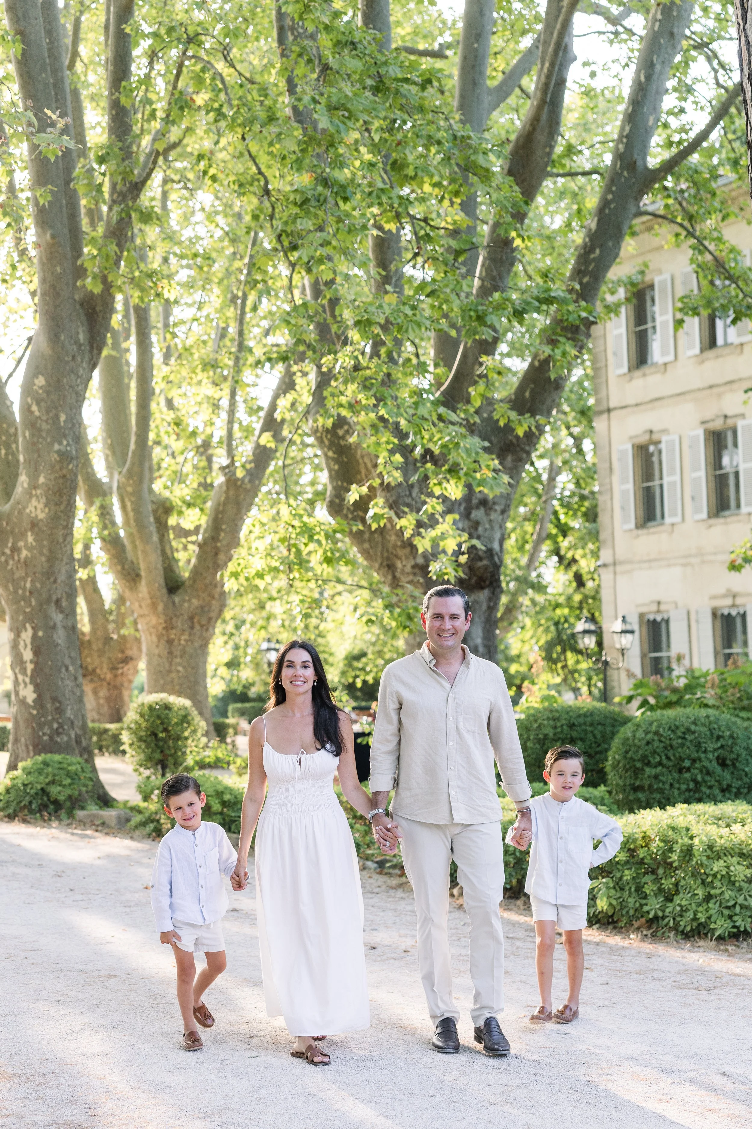 Family walking in the beautiful chateau des Alpilles in St Rémy de provence during a family photo session