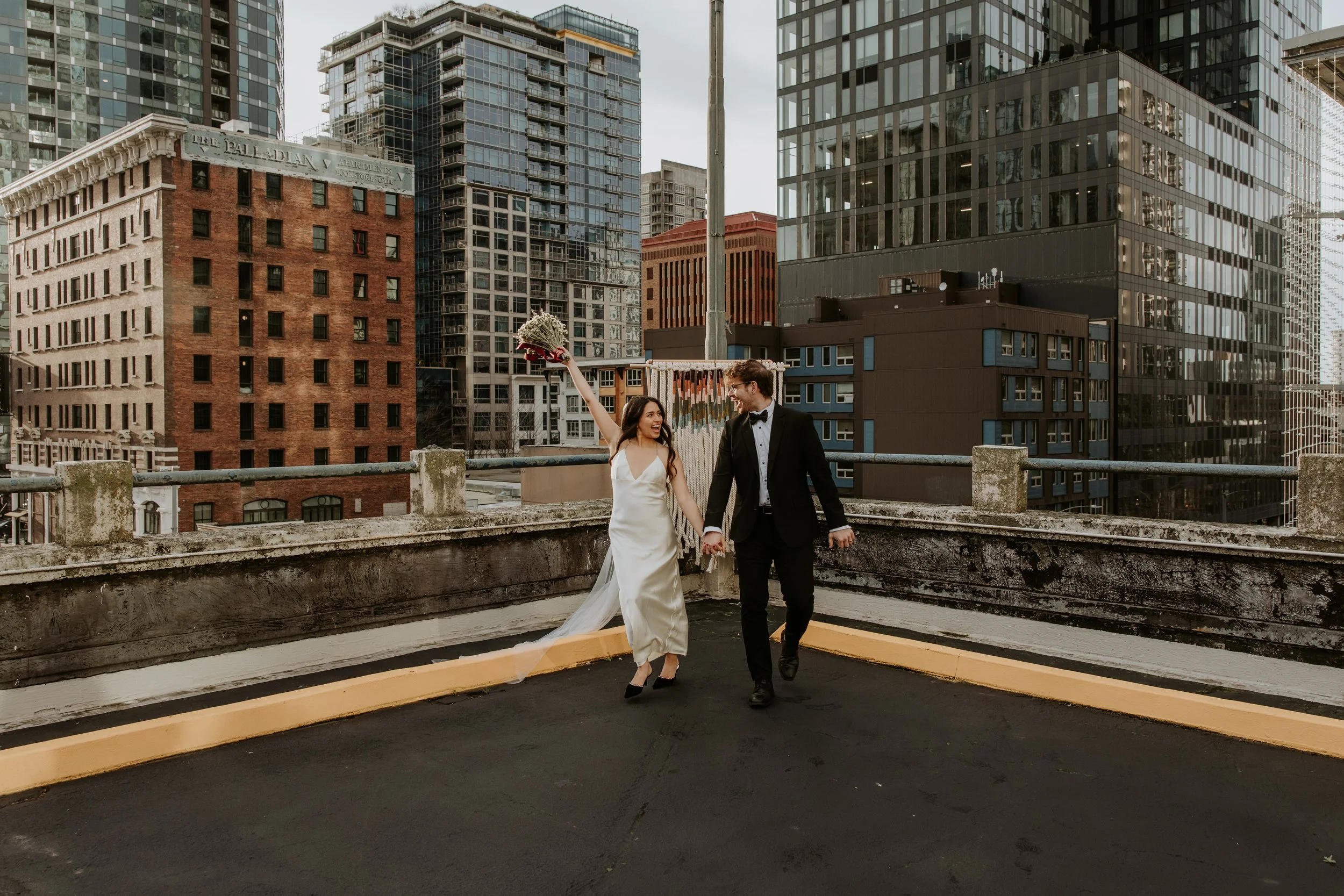 couple posing near pool after elopement