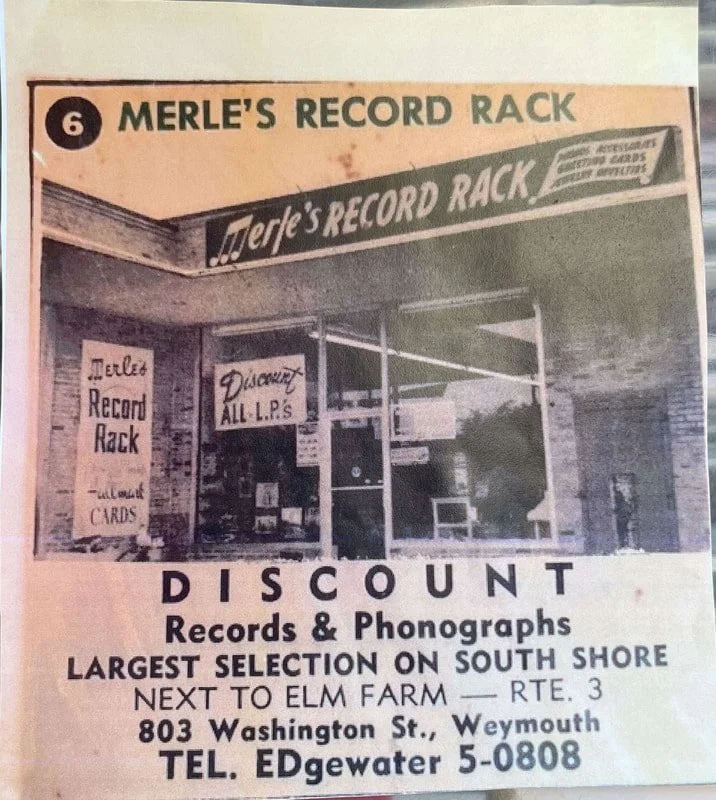 Vintage newspaper ad for Merle's Record Rack, a music store in Weymouth, Massachusetts. The ad features the store's storefront with signs advertising records, phonographs, and credit cards. It highlights the store's large selection on South Shore, ne